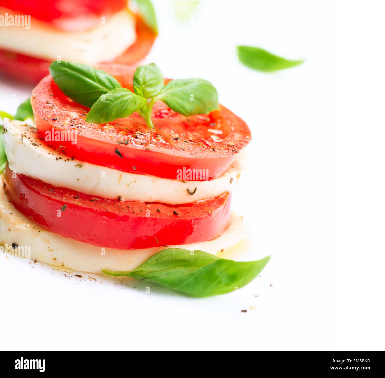 Caprese Salad. Tomato and Mozzarella slices with basil leaves Stock ...