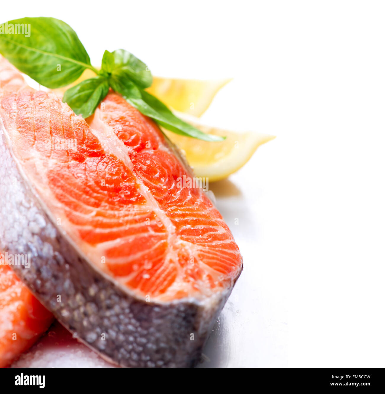 Raw Salmon Red Fish Steak with Herbs and Lemon isolated on White Stock ...