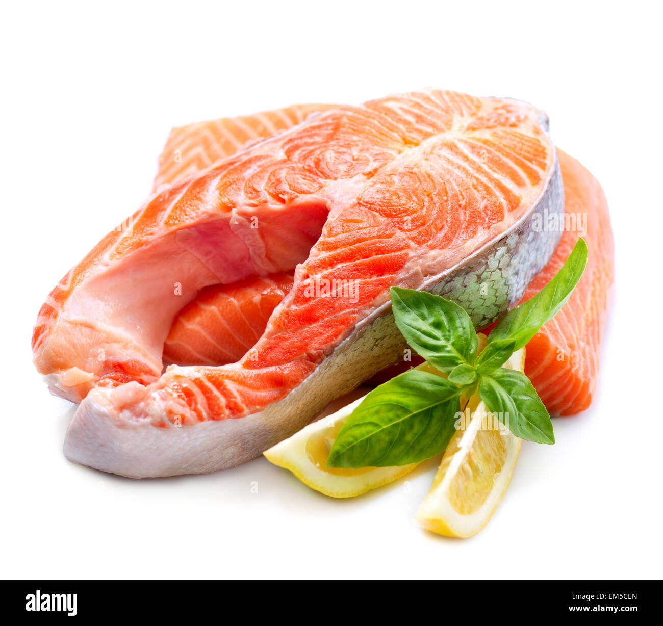 Raw Salmon Red Fish Steak with Herbs and Lemon isolated on White Stock Photo