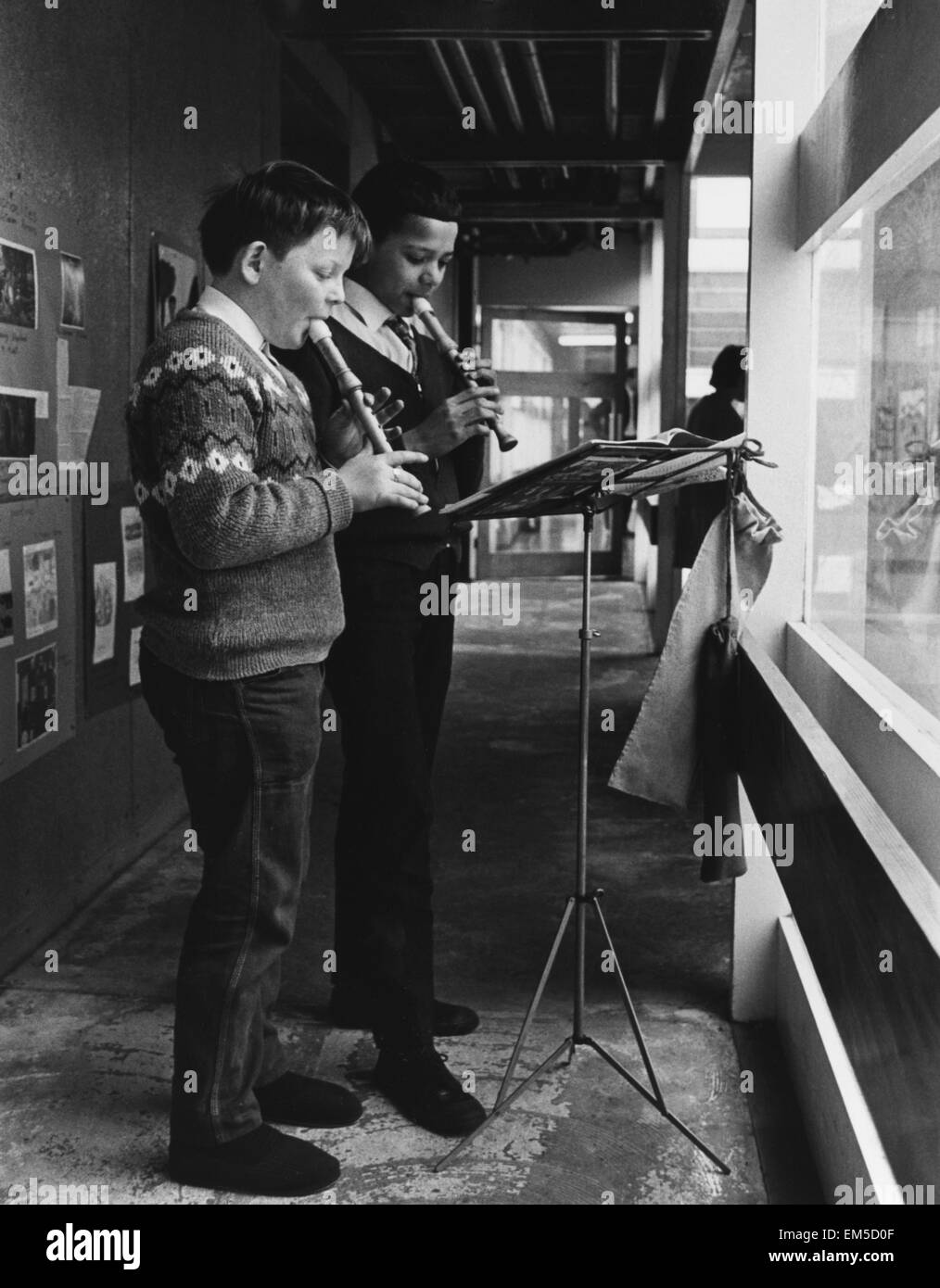 Two schoolboys playing the recorder during a music lesson at the Vittoria primary school in Islington built by the ILEA. Circa 1965. Stock Photo
