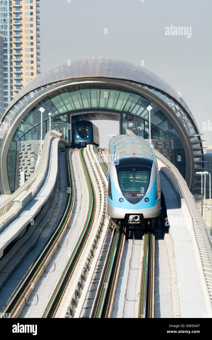 Metro train on elevated track in Dubai United Arab Emirates Stock Photo