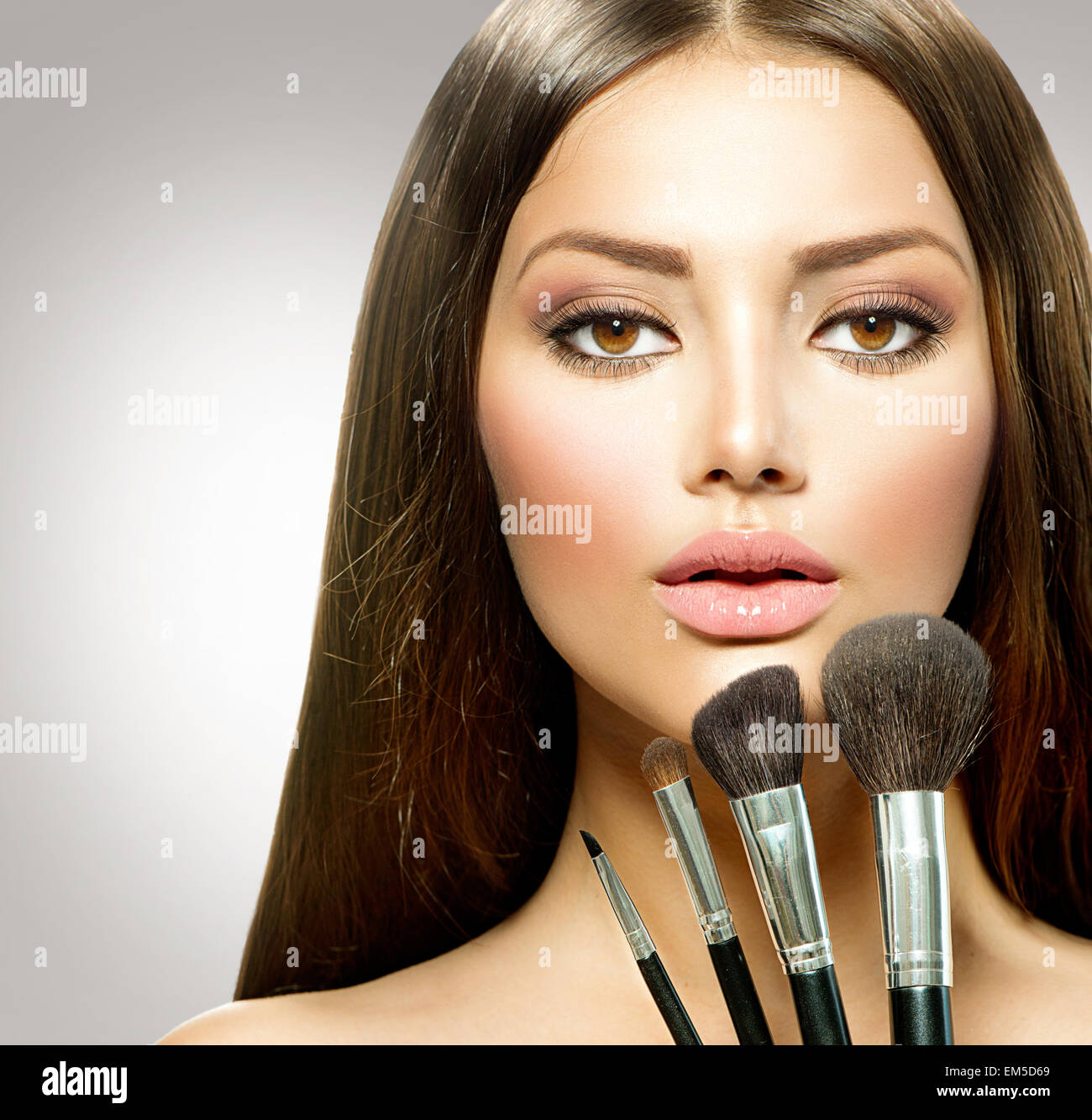 Beauty Girl with Makeup Brushes. Makeup for Woman Stock Photo