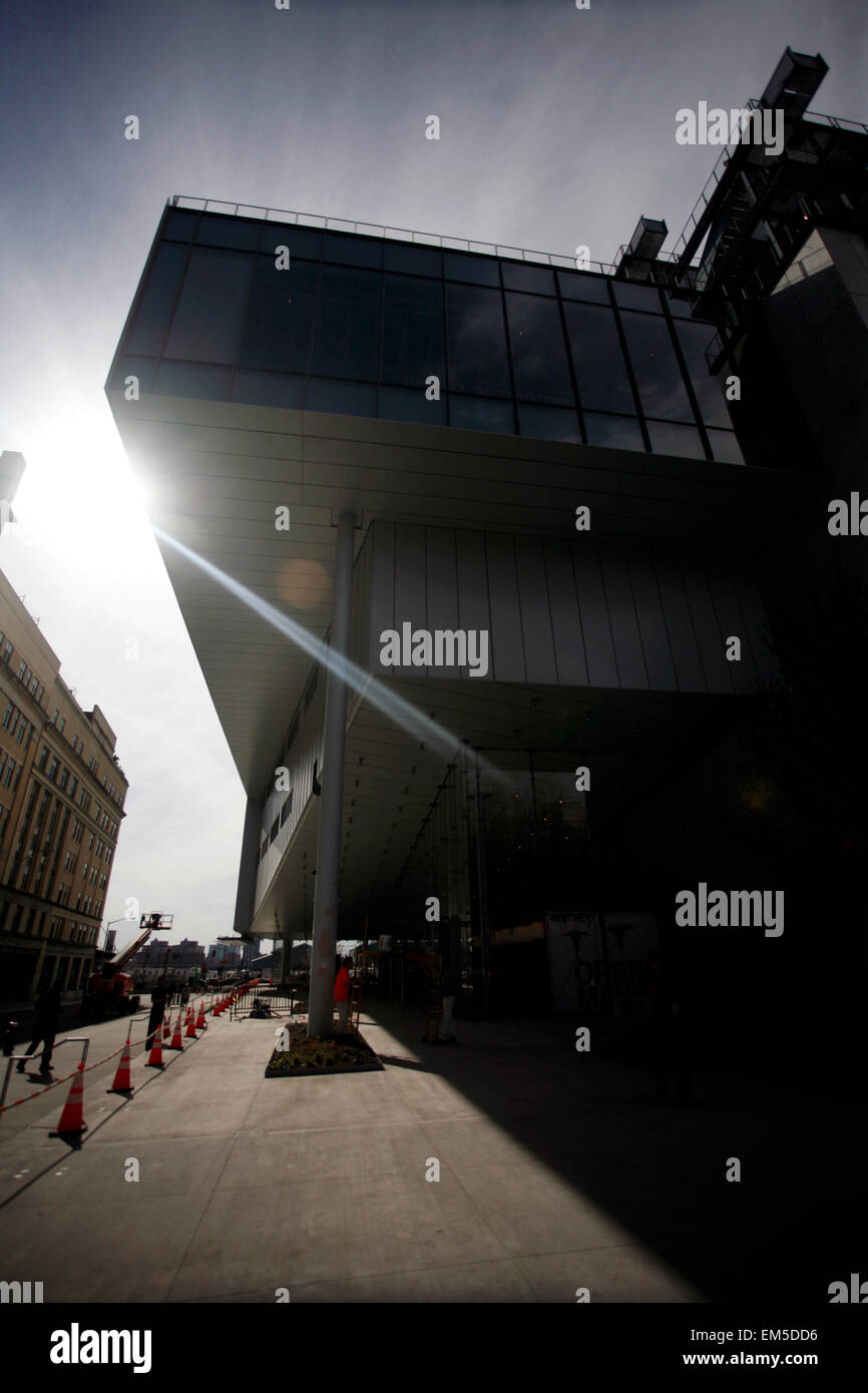 New York, USA. 15th Apr, 2015. Workers putting finishing touches on the new Whitney Museum of American Art building at Washington Street and Gansevoort Street, in New York City's Meatpacking District at the end of the High Line.   Designed by architect Renzo Piano, the 200,000-square-foot space will open to the public on May 1st, 2015 Stock Photo