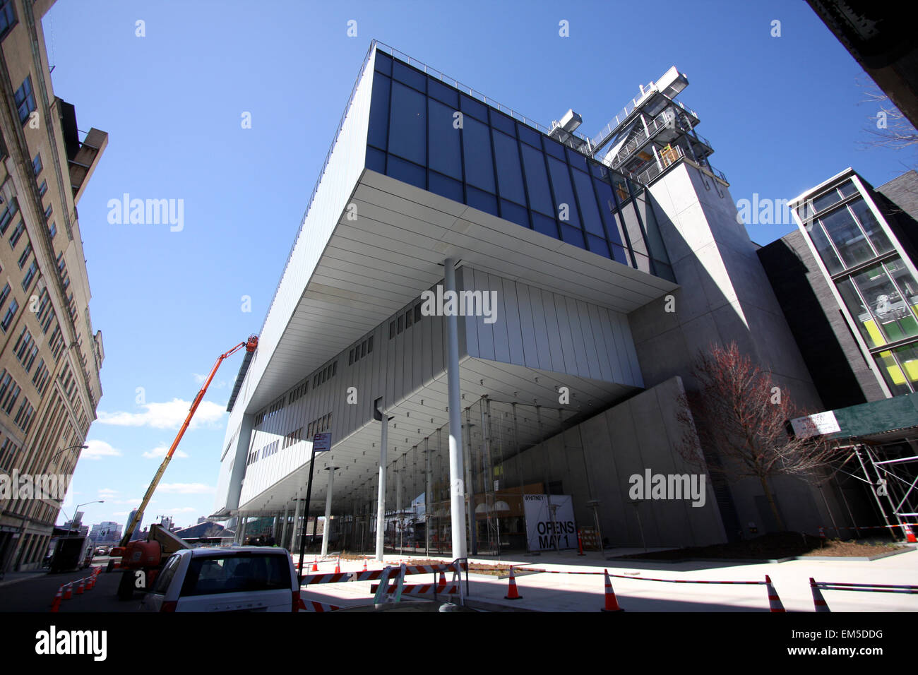 New York, USA. 15th Apr, 2015. Construction workers putting finishing touches on the new Whitney Museum of American Art building at Washington Street and Gansevoort Street, in New York City's Meatpacking District at the end of the High Line.   Designed by architect Renzo Piano, the 200,000-square-foot space will open to the public on May 1st, 2015 Stock Photo