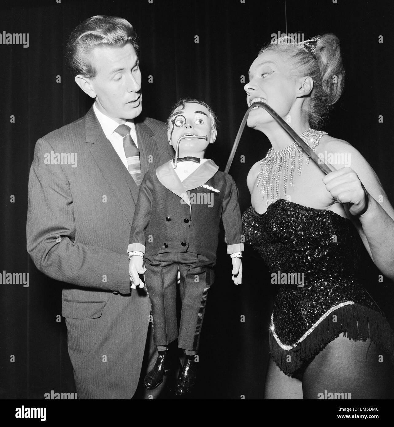 Ventriloquist Ray Alan with puppet Lord Charles, meet London Strong Woman Joan Rhodes at the Magic Circle Festival, being held at the Scala Theatre in London October 1962. Stock Photo
