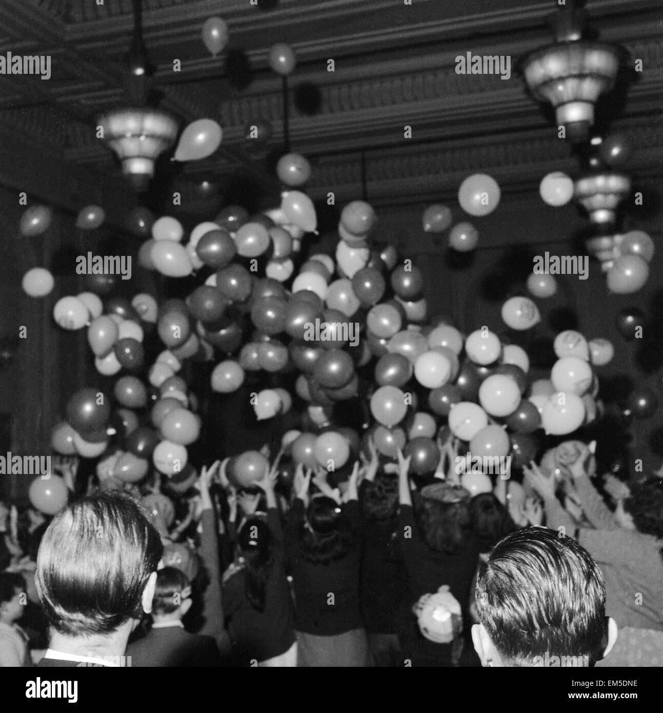 Balloons being released at a children's party in Soho, London. December 1956 Stock Photo Alamy