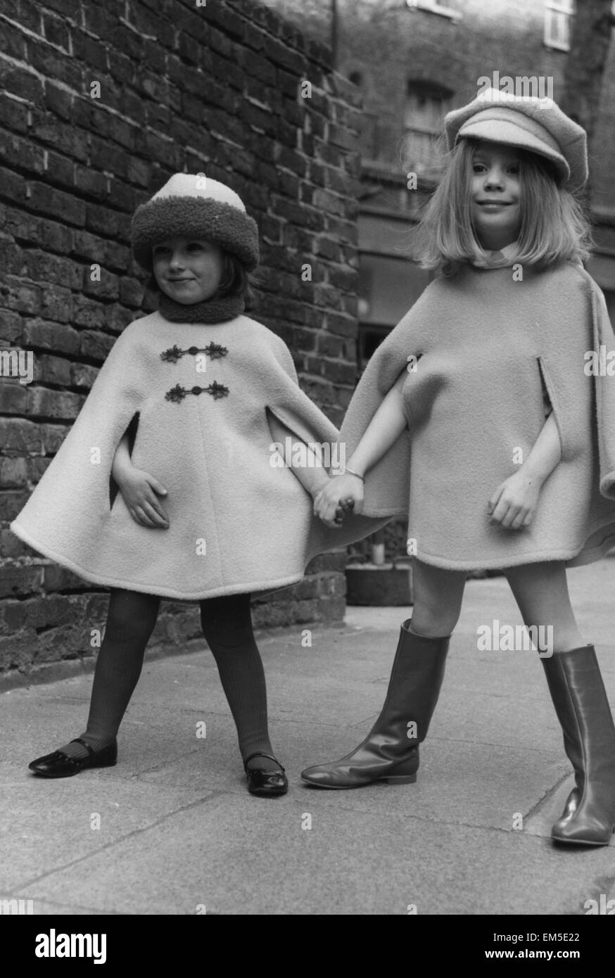 Lee Anne aged 3 wearing a Bolshoi Pink cape with fur trim with Sarah Barnett aged 4 seen wearing a Pavlova pink cape, both were designed by Mary Louise fashions 5th April 1967 Stock Photo