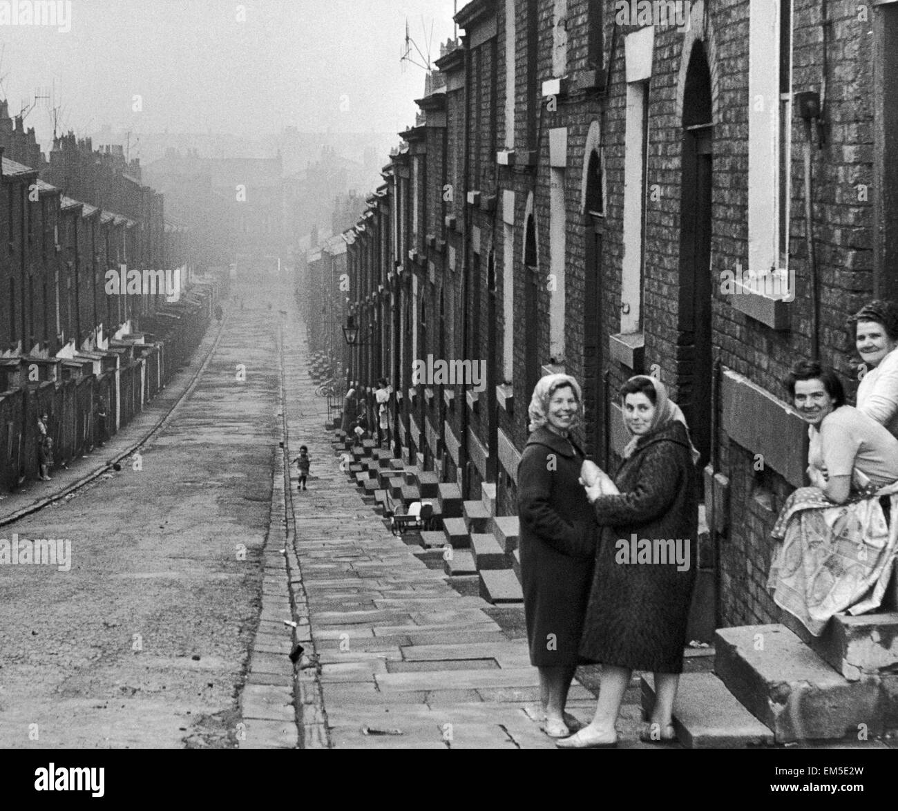 Mrs Ada Jameson and her daughter Jean, pictured standing outside the steps of their condemned home on Ellison Street in Liverpool, after receiving visit from Housing Minister, Dr Charles Hill, June 1962. Stock Photo