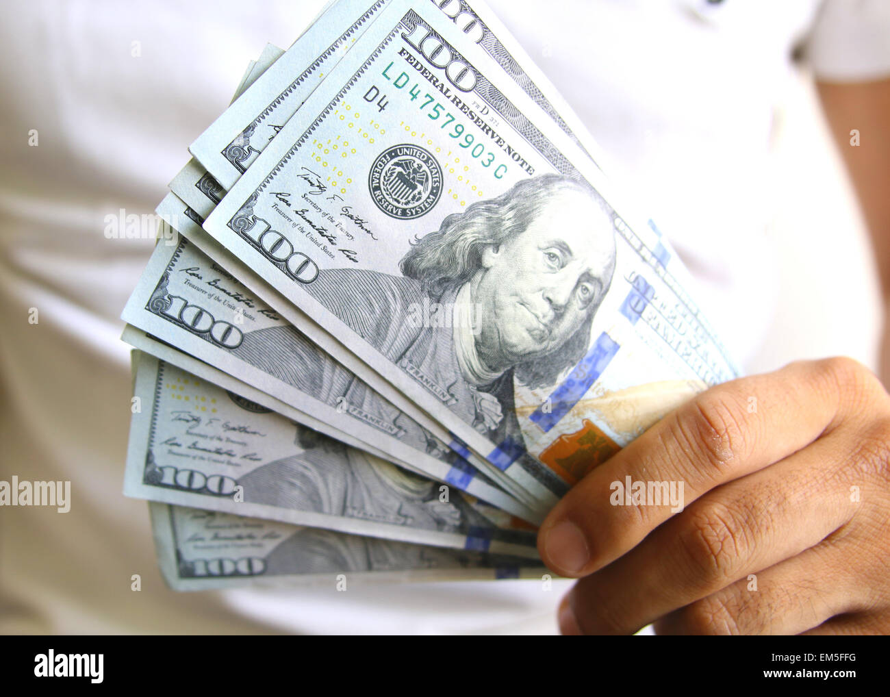 Man Displaying a Spread of Cash. Business success concept Stock Photo ...