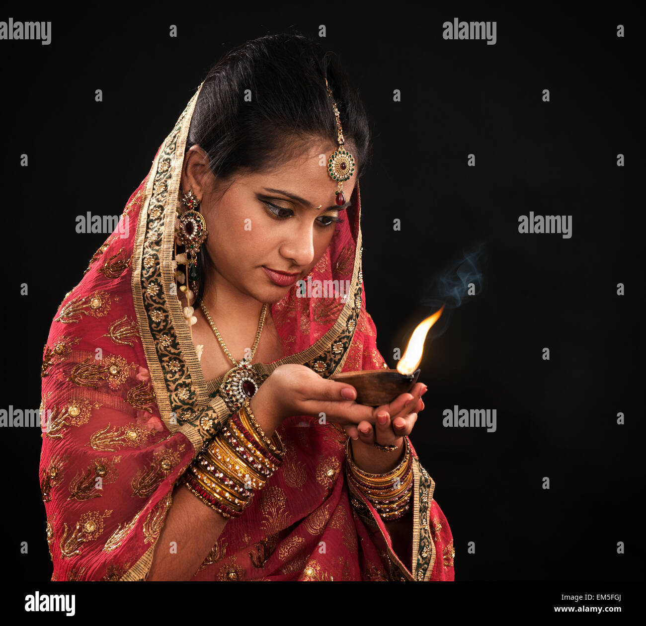 Diwali Indian woman with oil lamp Stock Photo Alamy