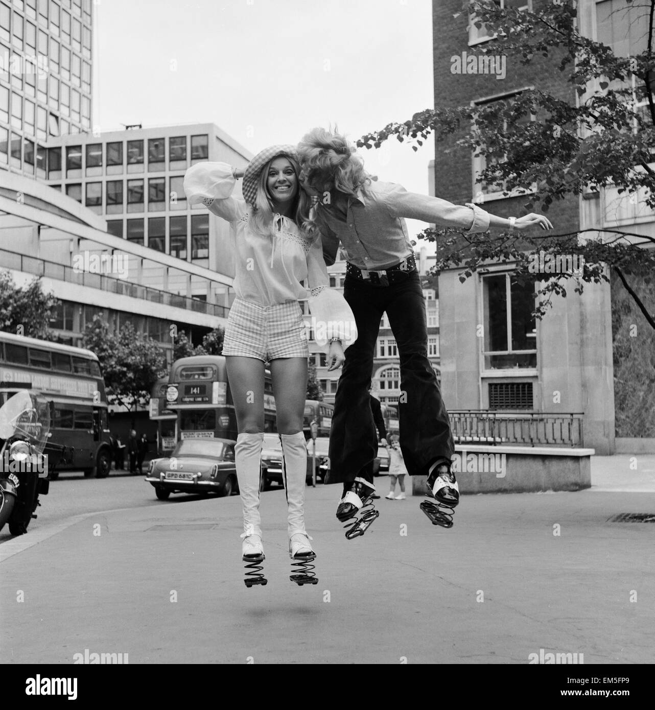 Heather Beckers and Nigel Lythgoe of the Young Generation dance troupe trying out a pair of jump shoes, the latest American craze to arrive in London. 29th June 1971. Stock Photo