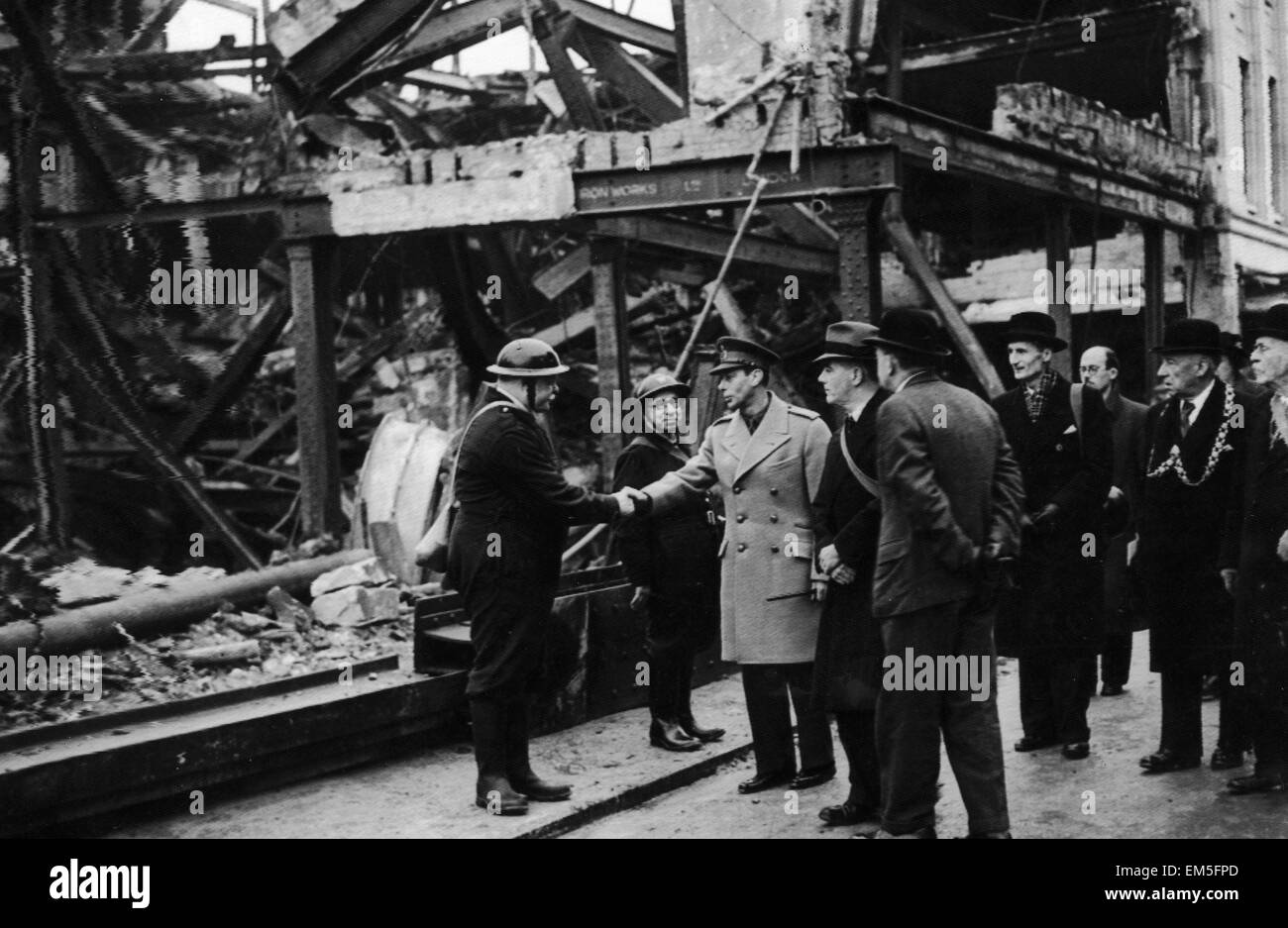 King George VI meets air raid wardens during his visit to the bomed damaged city of Bristol following an air raid. December 1940. Stock Photo