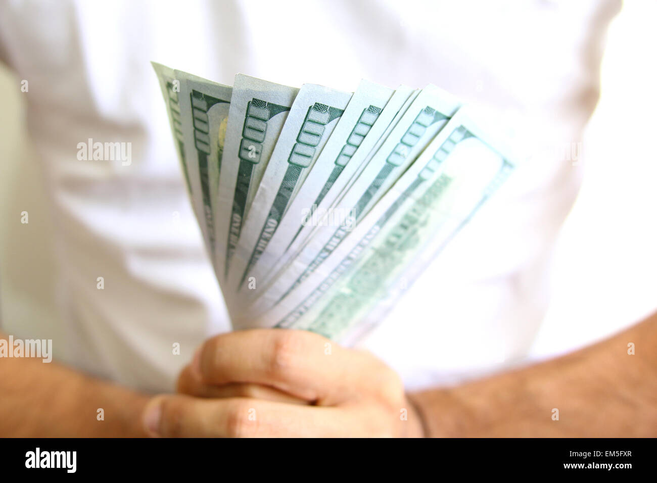 Man Displaying a Spread of Cash. Business success concept Stock Photo ...