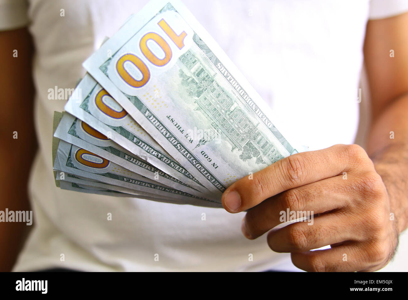 Man Displaying a Spread of Cash. Business success concept Stock Photo ...