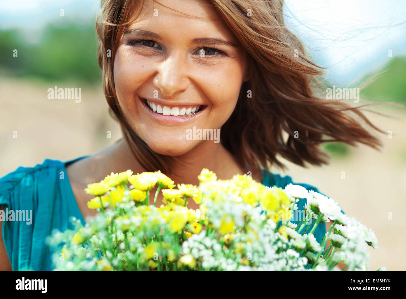 Girl holding bouquet of flowers Stock Photo Alamy