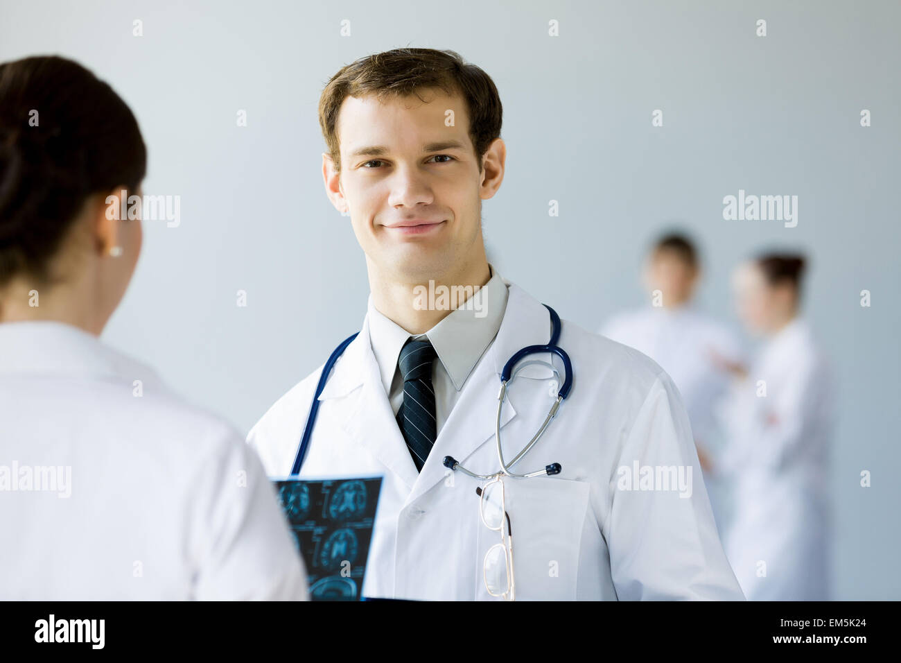 Young doctor in white uniform hi-res stock photography and images - Alamy