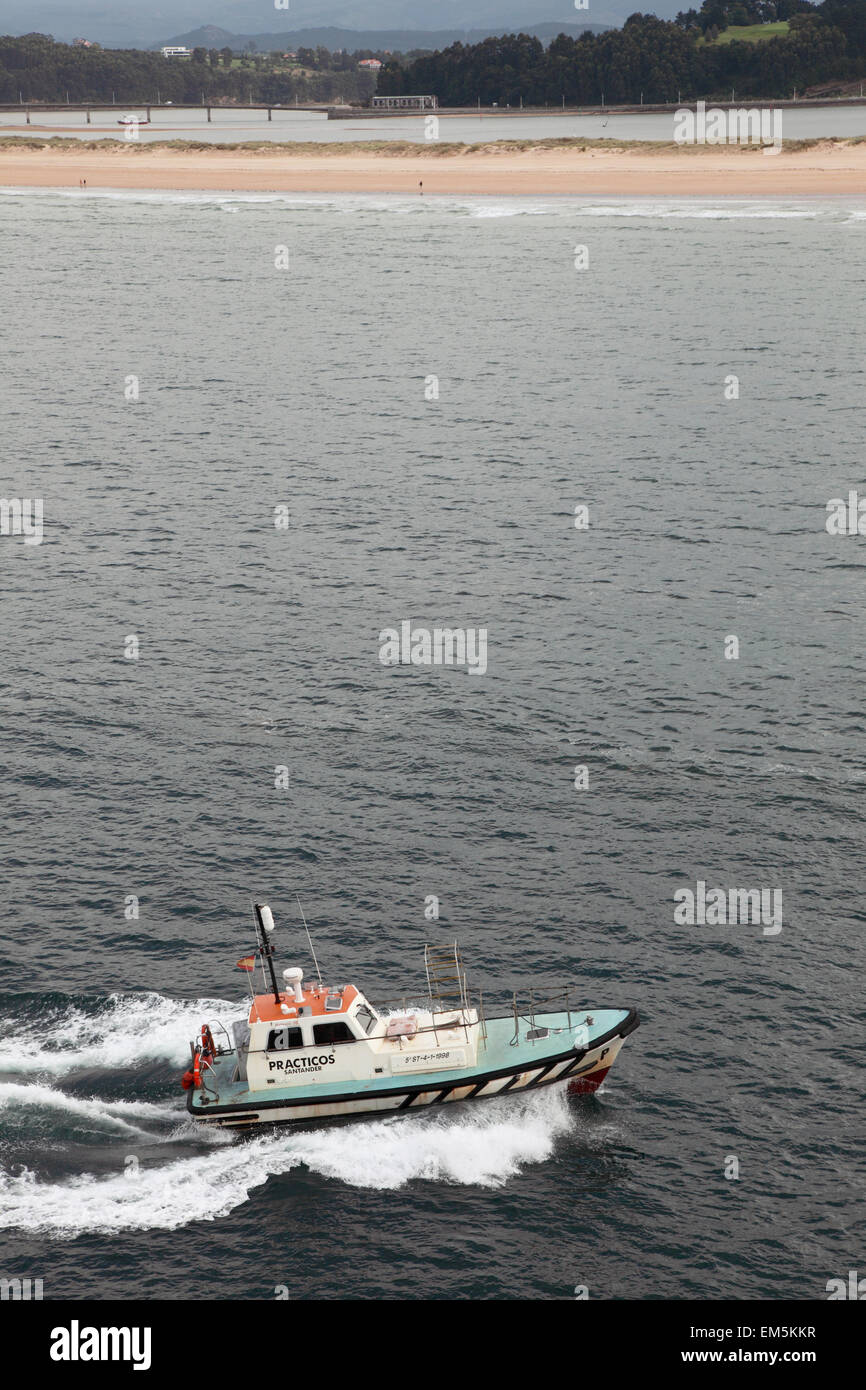 A pilot boat accompanying the Brittany ferry Pont Aven as it arrives in Santander Spain Stock Photo