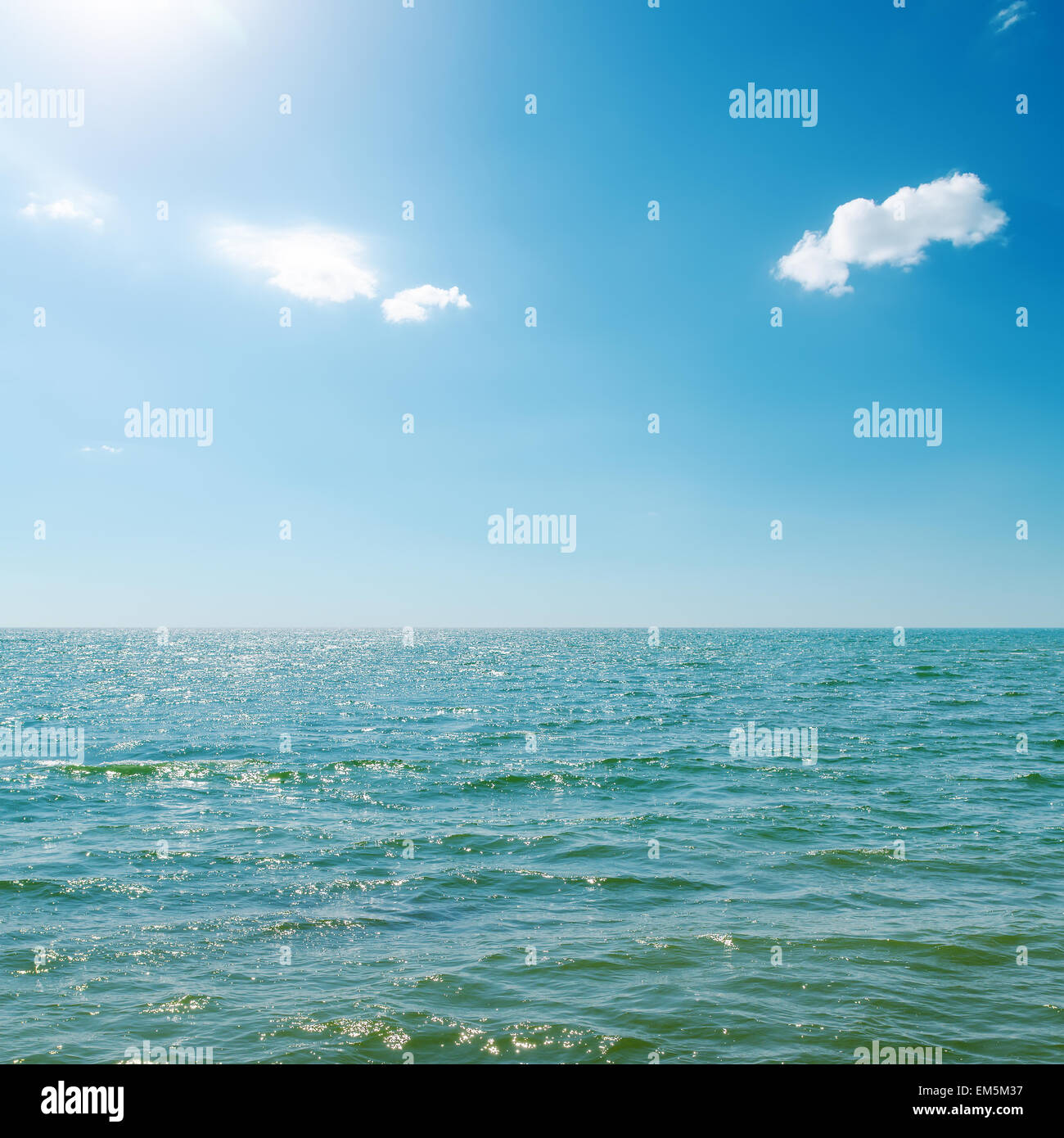 blue sky with sun and clouds over sea Stock Photo - Alamy