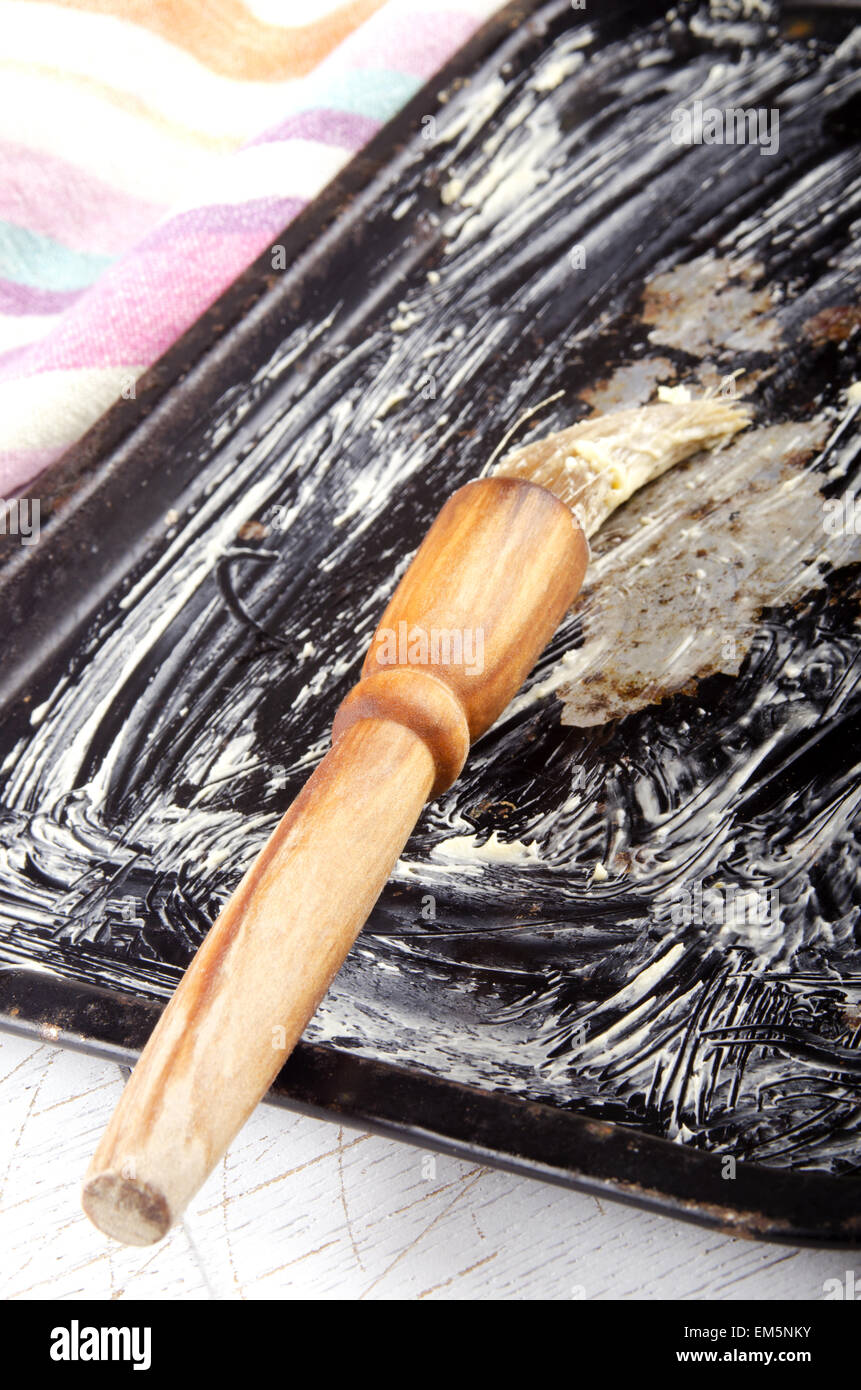 baking tray greased with margarine Stock Photo Alamy