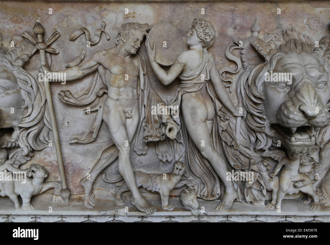 Sarcophagus with Dionysus in the center and Maenad (maybe Ariadne)  with baby cupid and panther. Stock Photo
