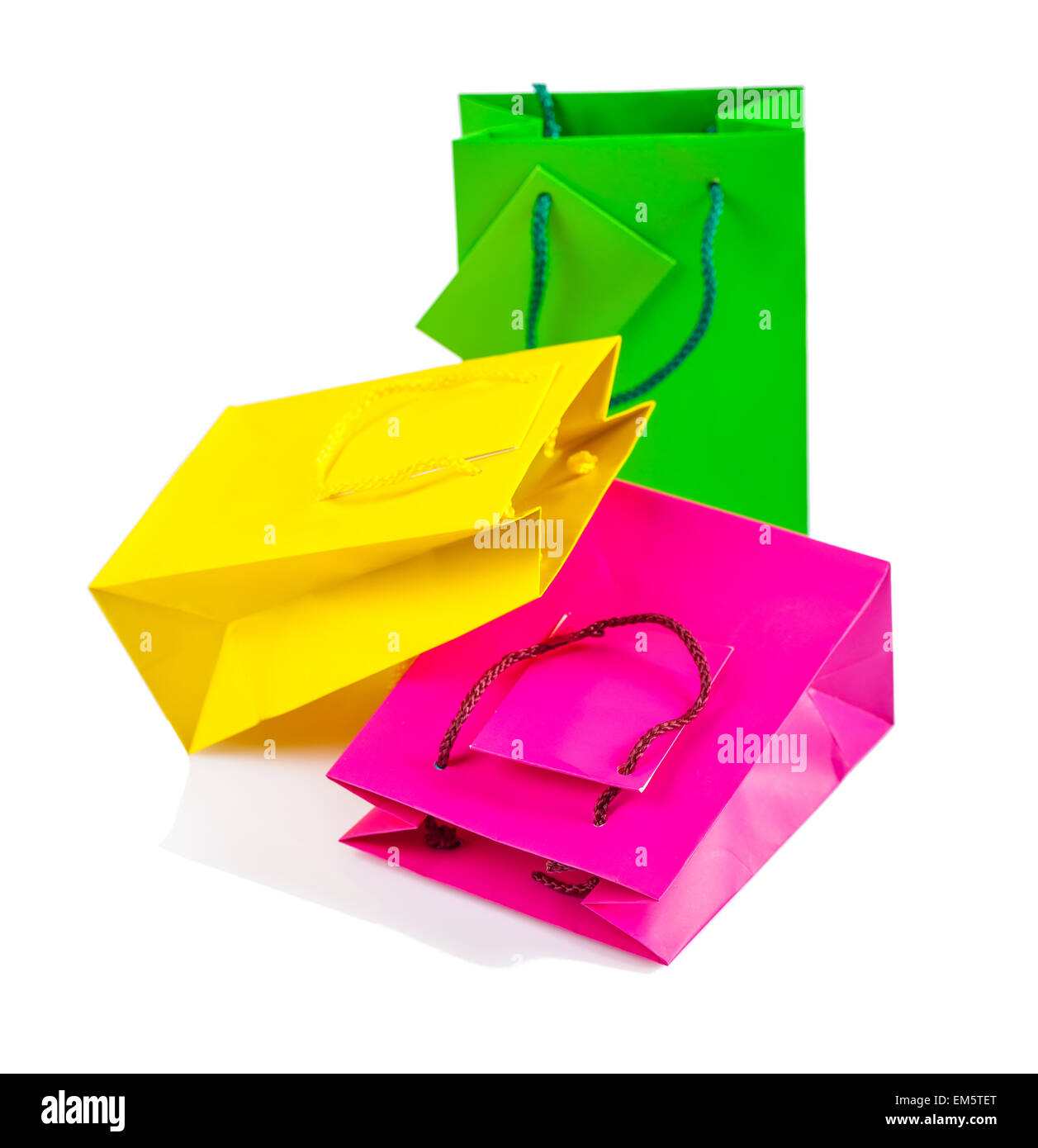 three clored paper bags isolated Stock Photo - Alamy