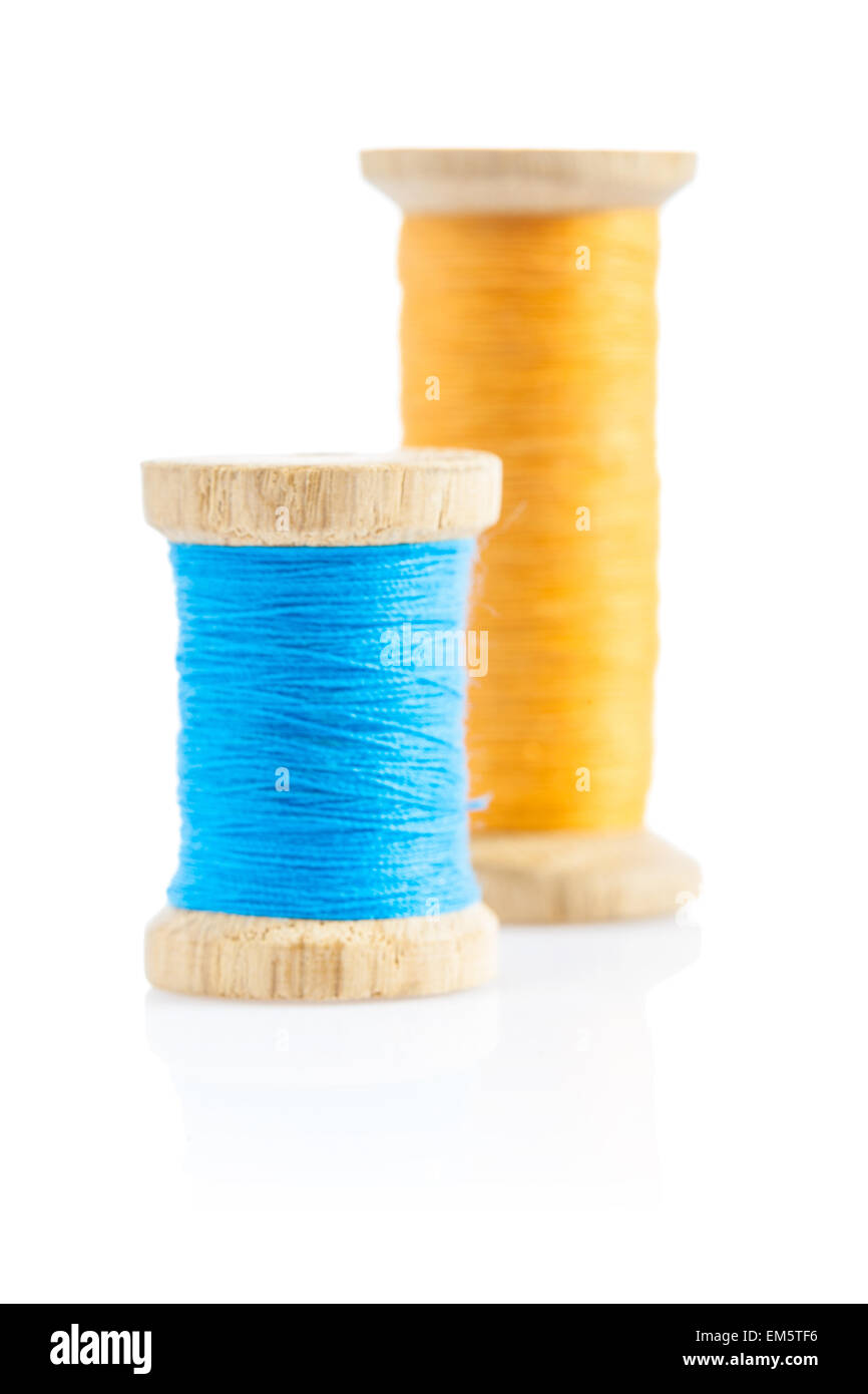 two bobbins with sewing thread Stock Photo