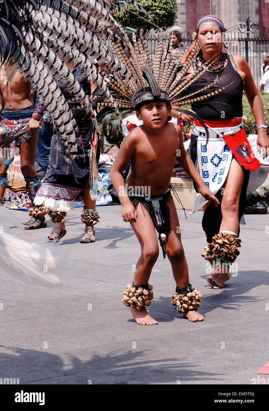 native Aztec dancers dancing performing in feathered headdress in the Zocalo, Mexico City