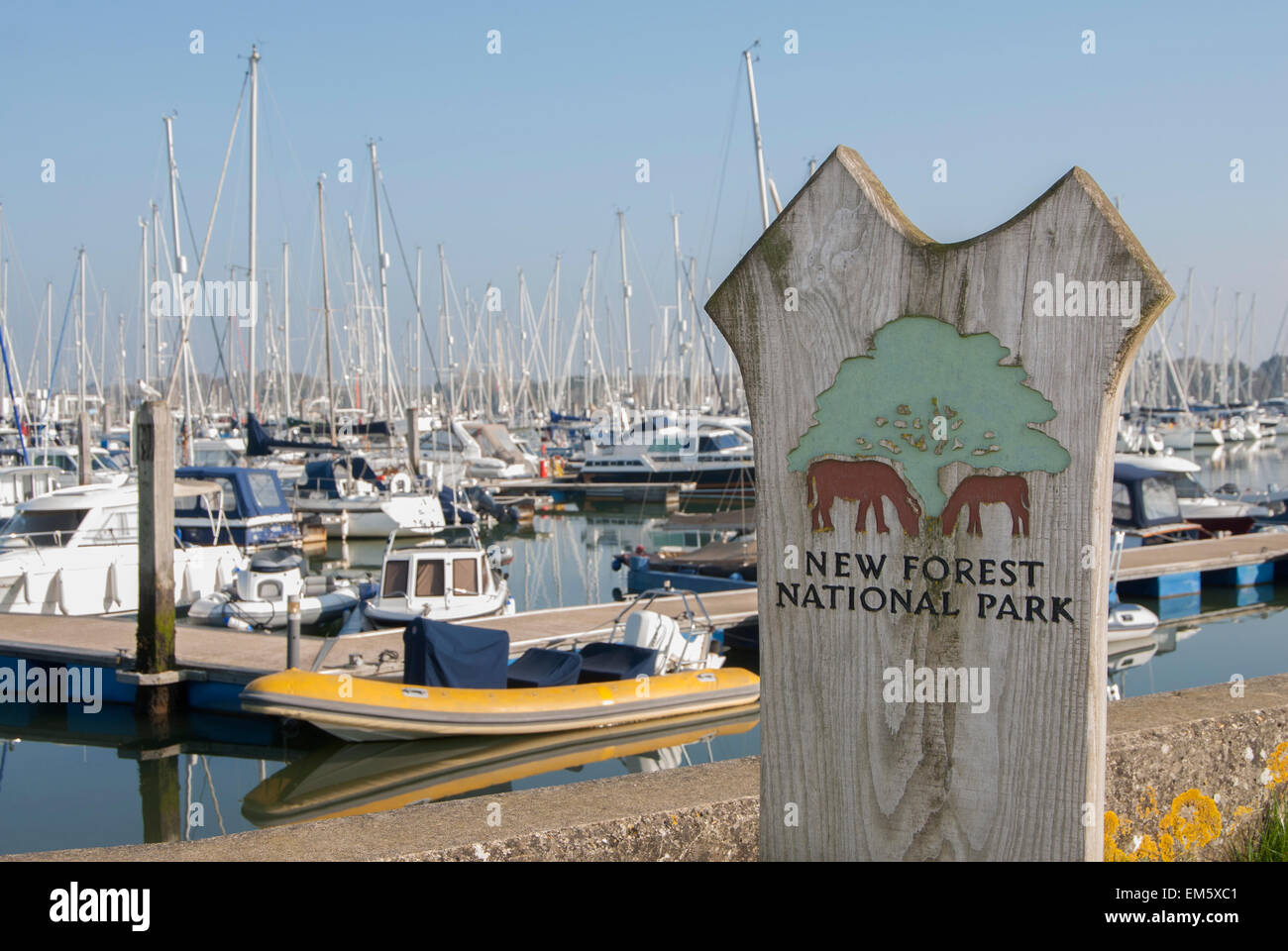 New Forest National Park sign with Lymington Yacht Haven in background Stock Photo