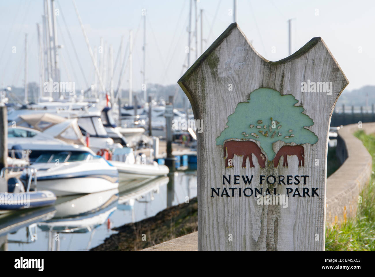 New Forest National Park sign with Lymington Yacht Haven in background Stock Photo