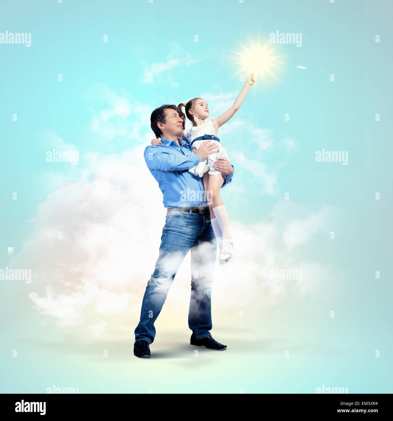 Father holding on hands daughter Stock Photo - Alamy