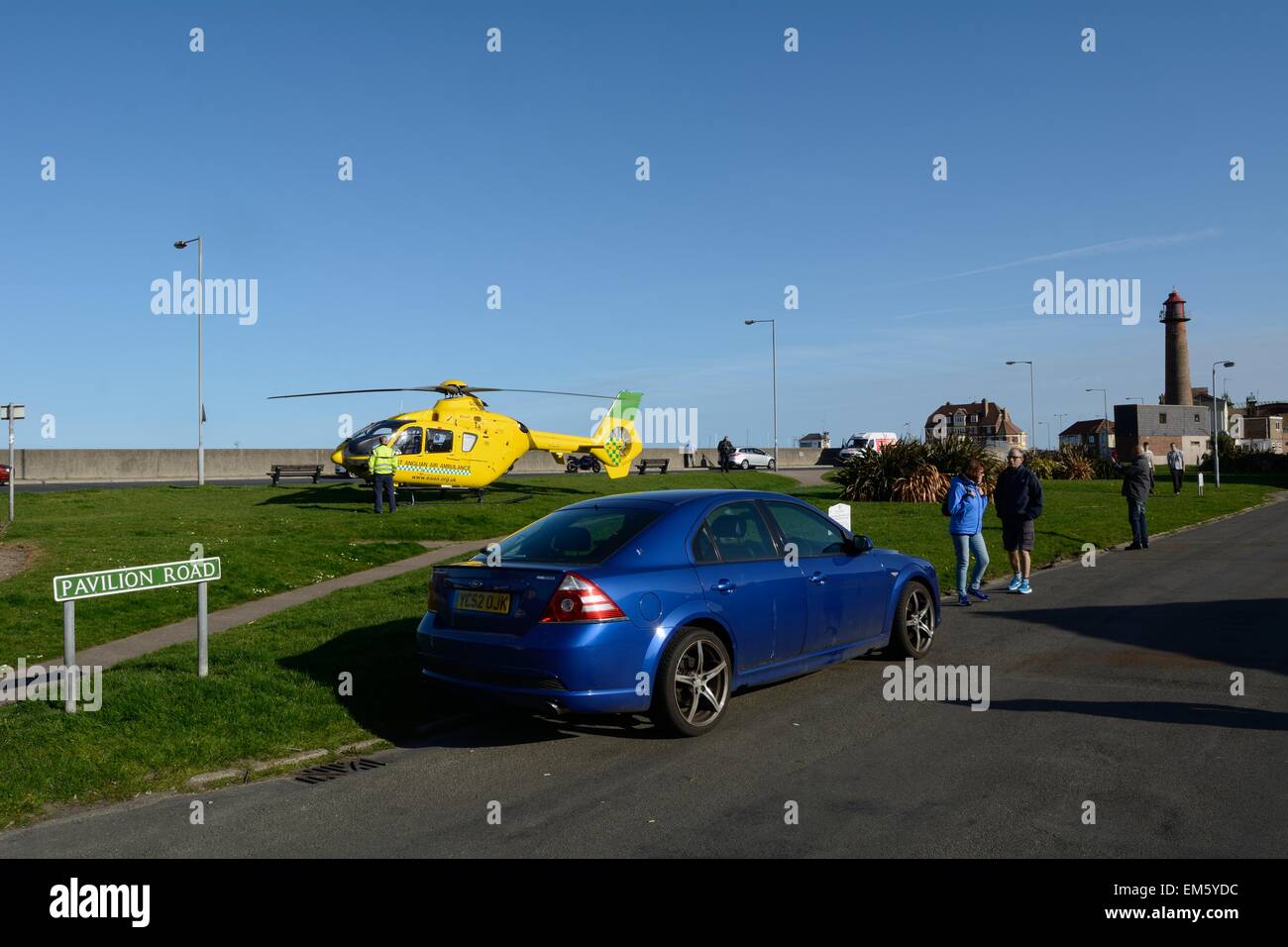 Gorleston, Norfolk, UK. 16th April, 2015. Air Ambulance lands in Gorleston to assist with a person needing attention outside Peggoty's Public House Credit:  Stephen Gostick/Alamy Live News Stock Photo