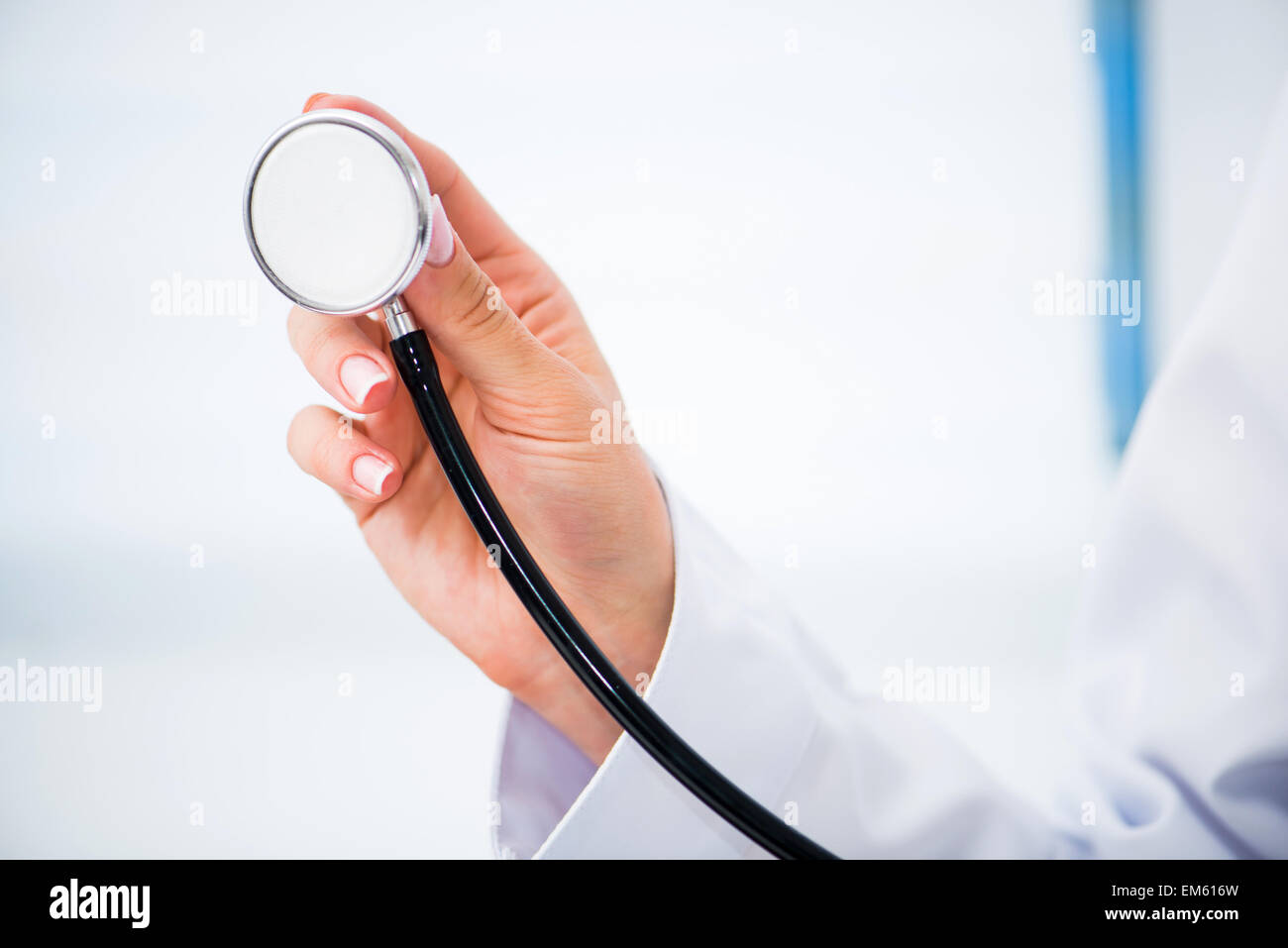 Hand holding stethoscope Stock Photo