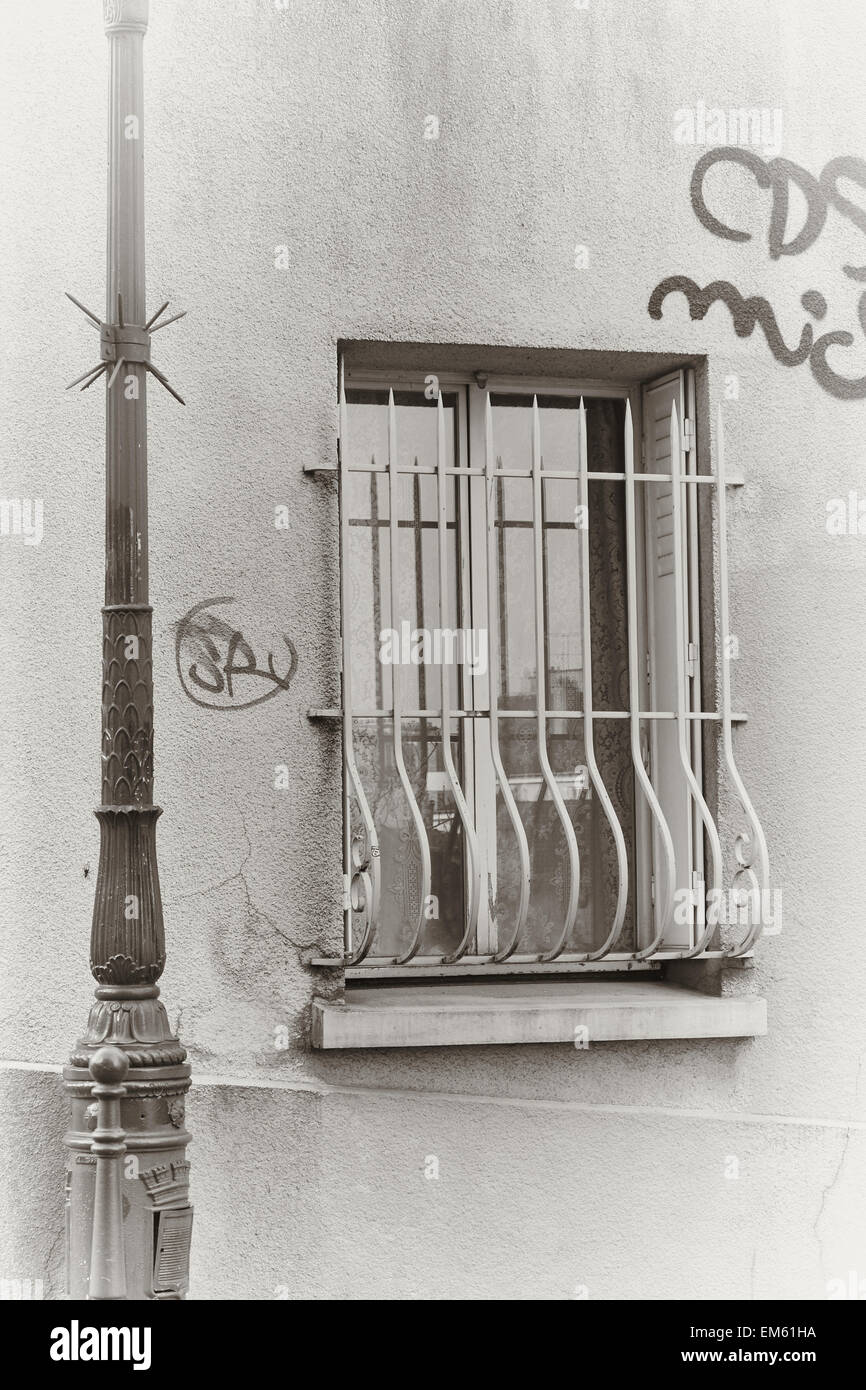 Wrought iron window grill and graffiti Montmartre Paris France Europe Stock Photo