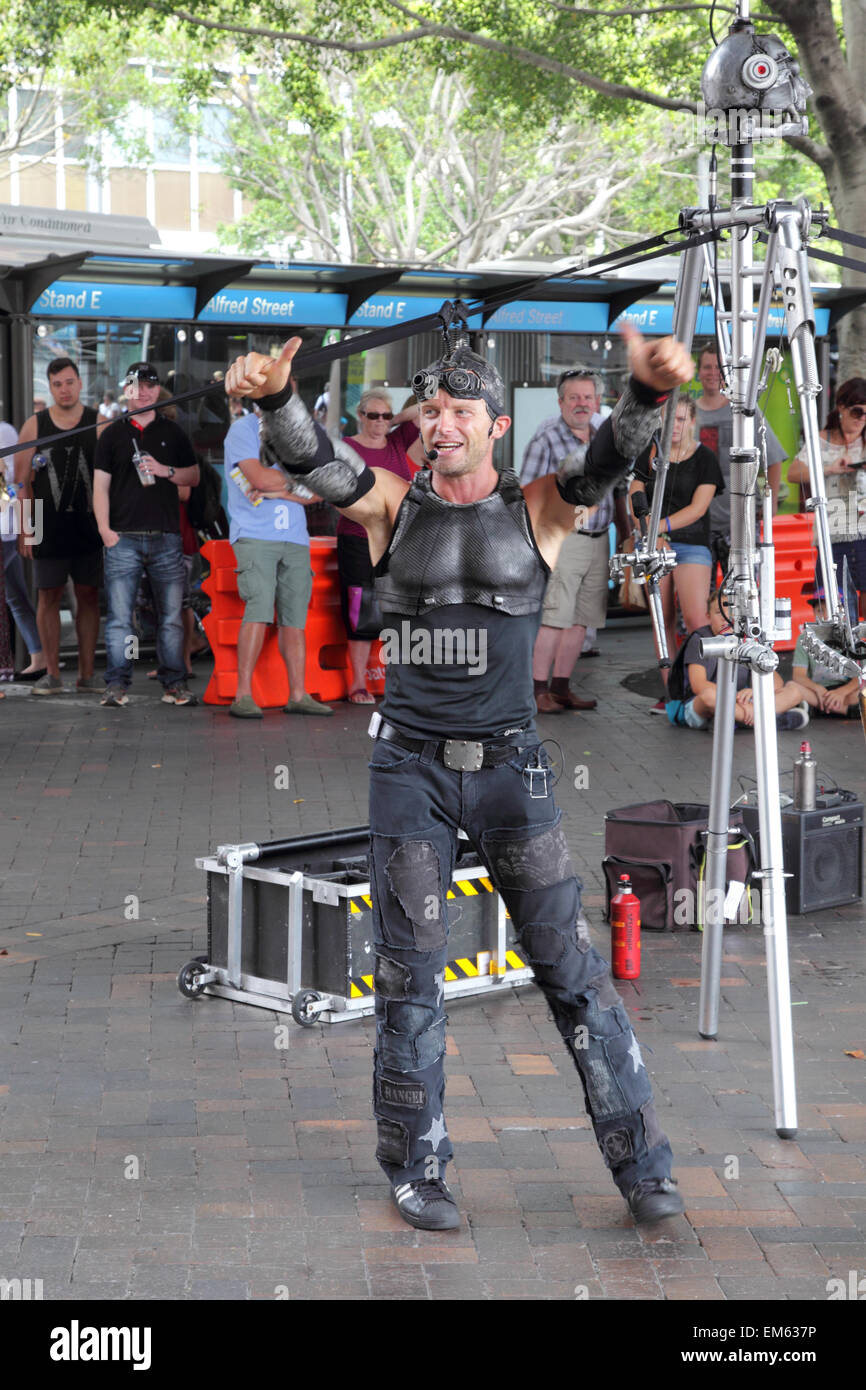 Street Artist juggling with burning torches during a performance at  Circular Quay, Sydney, Australia. Stock Photo