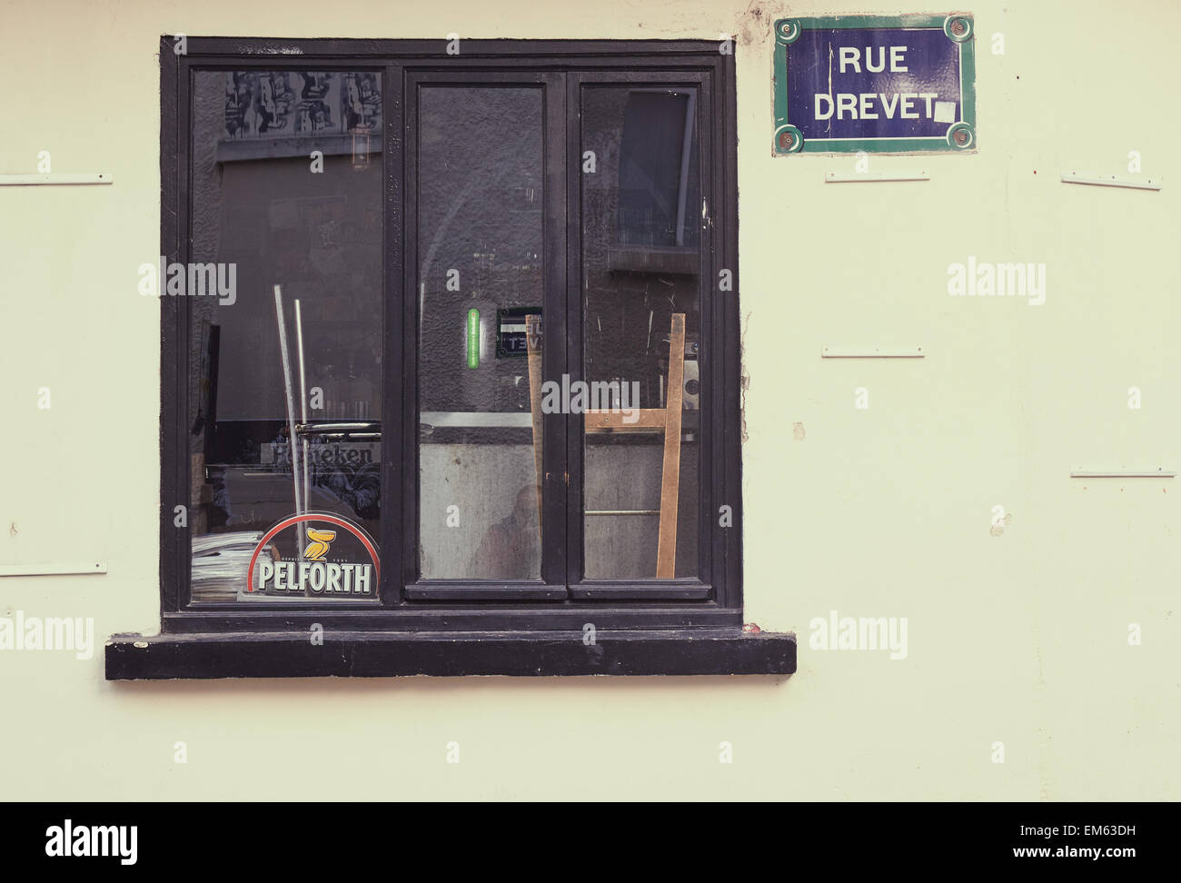 Through the window of a closed bar in Rue Drevet Montmartre Paris