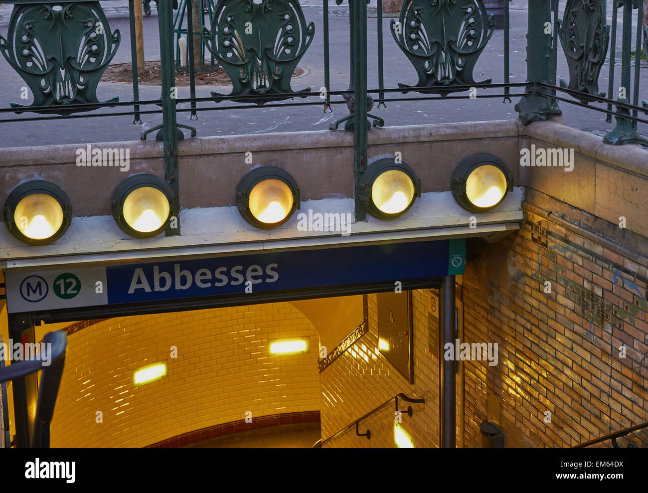 Illuminated art nouveau entrance to the stylish Abbesses metro station Montmartre Paris France Europe Stock Photo
