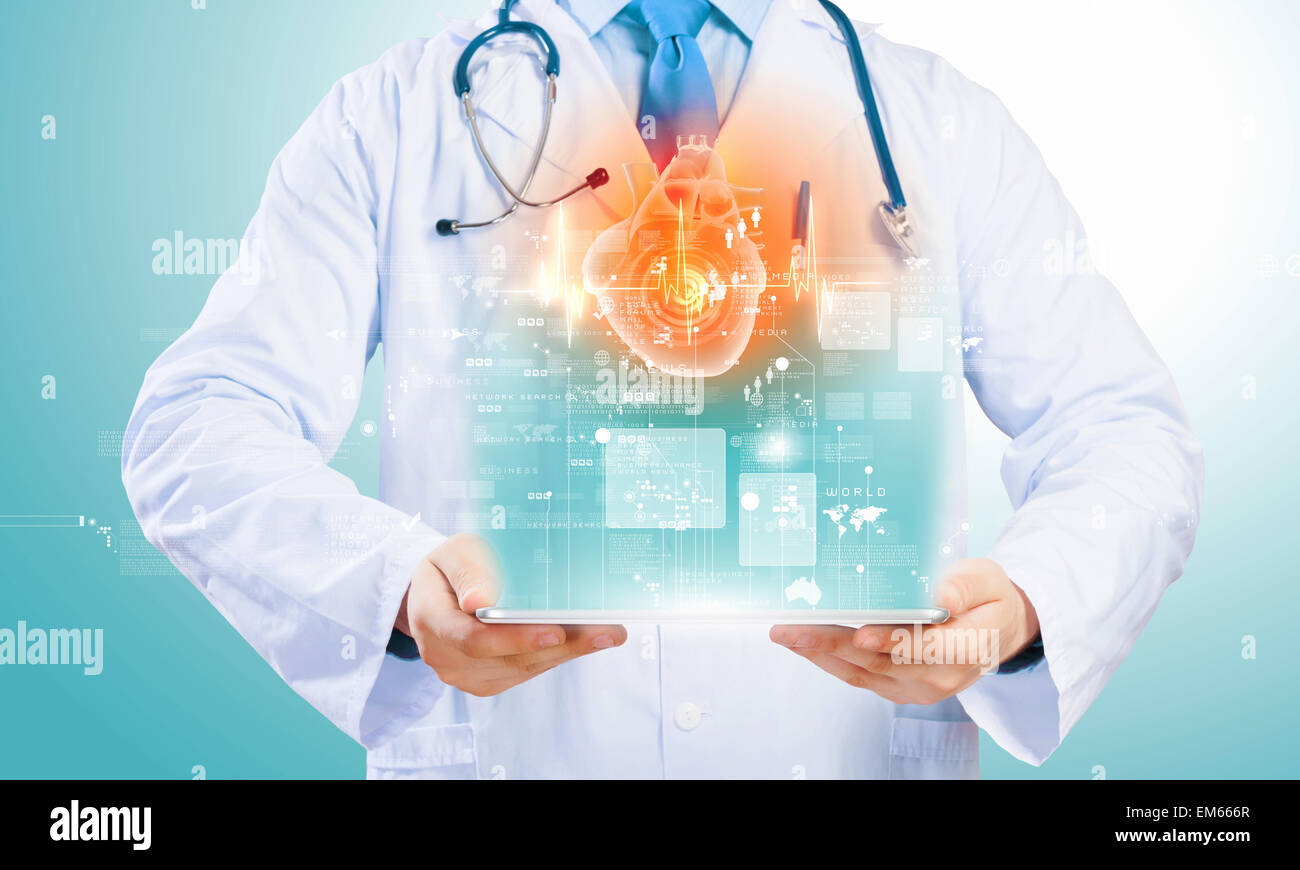 Doctor holding tablet pc Stock Photo - Alamy