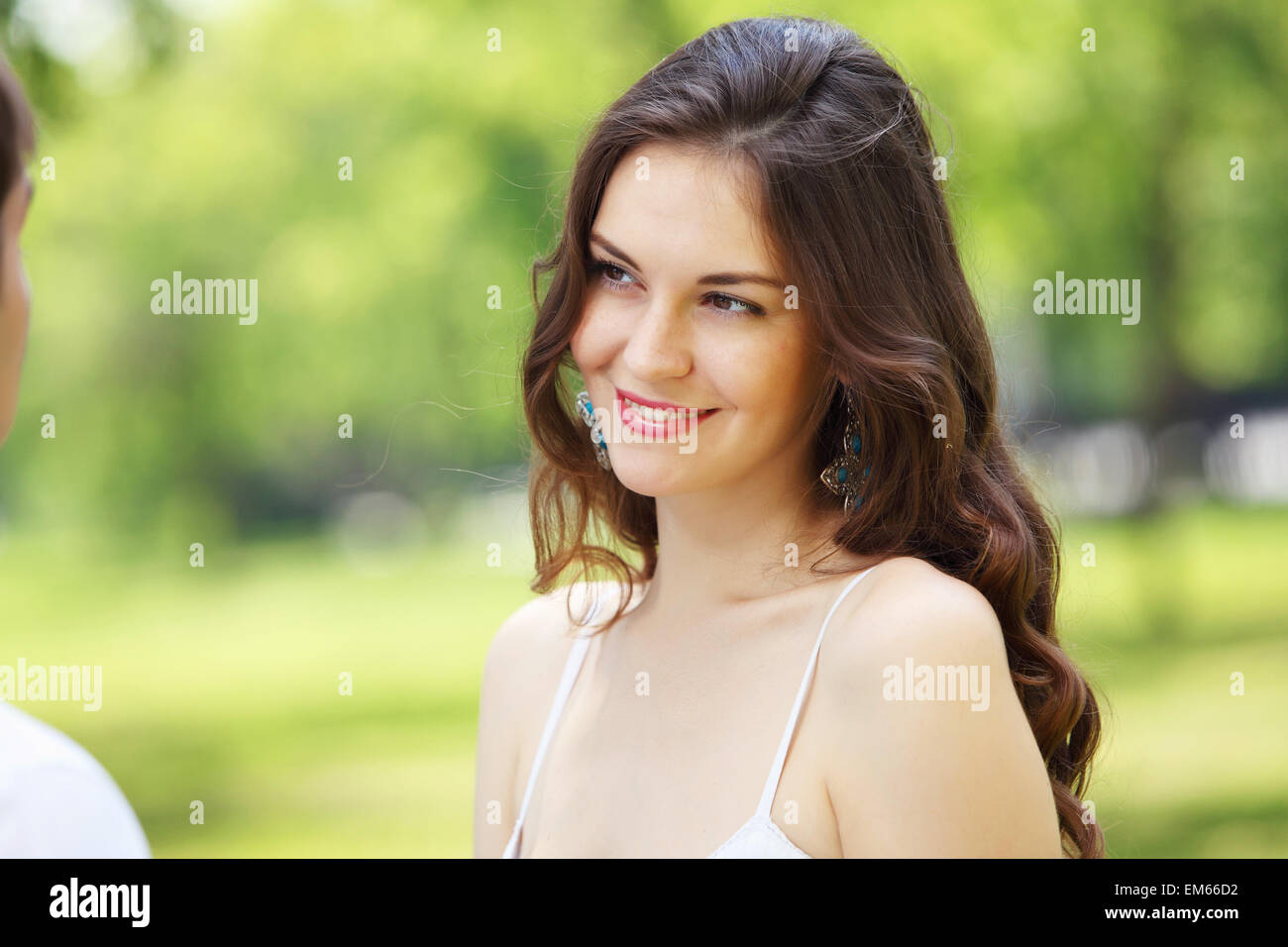 Young love Couple smiling under blue sky Stock Photo - Alamy