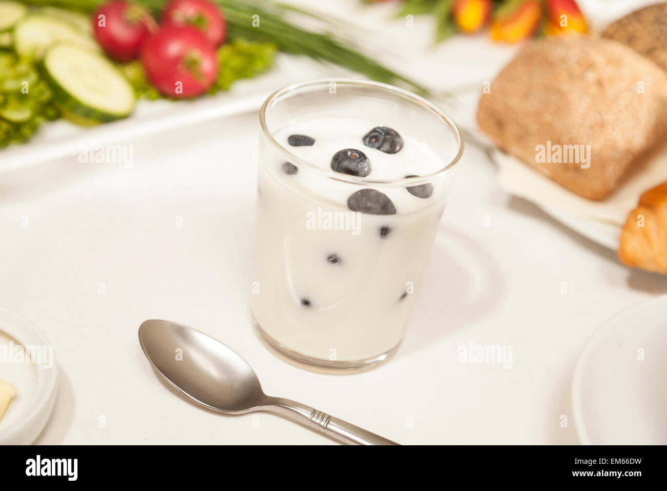 Glass of huckleberry yogurt Stock Photo