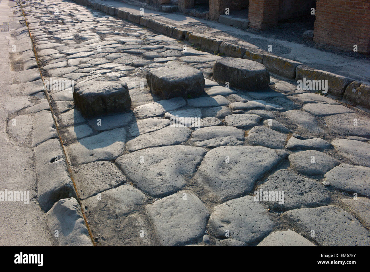 Pompeii, Italy. Raised stepping stones across the cobbled street at the