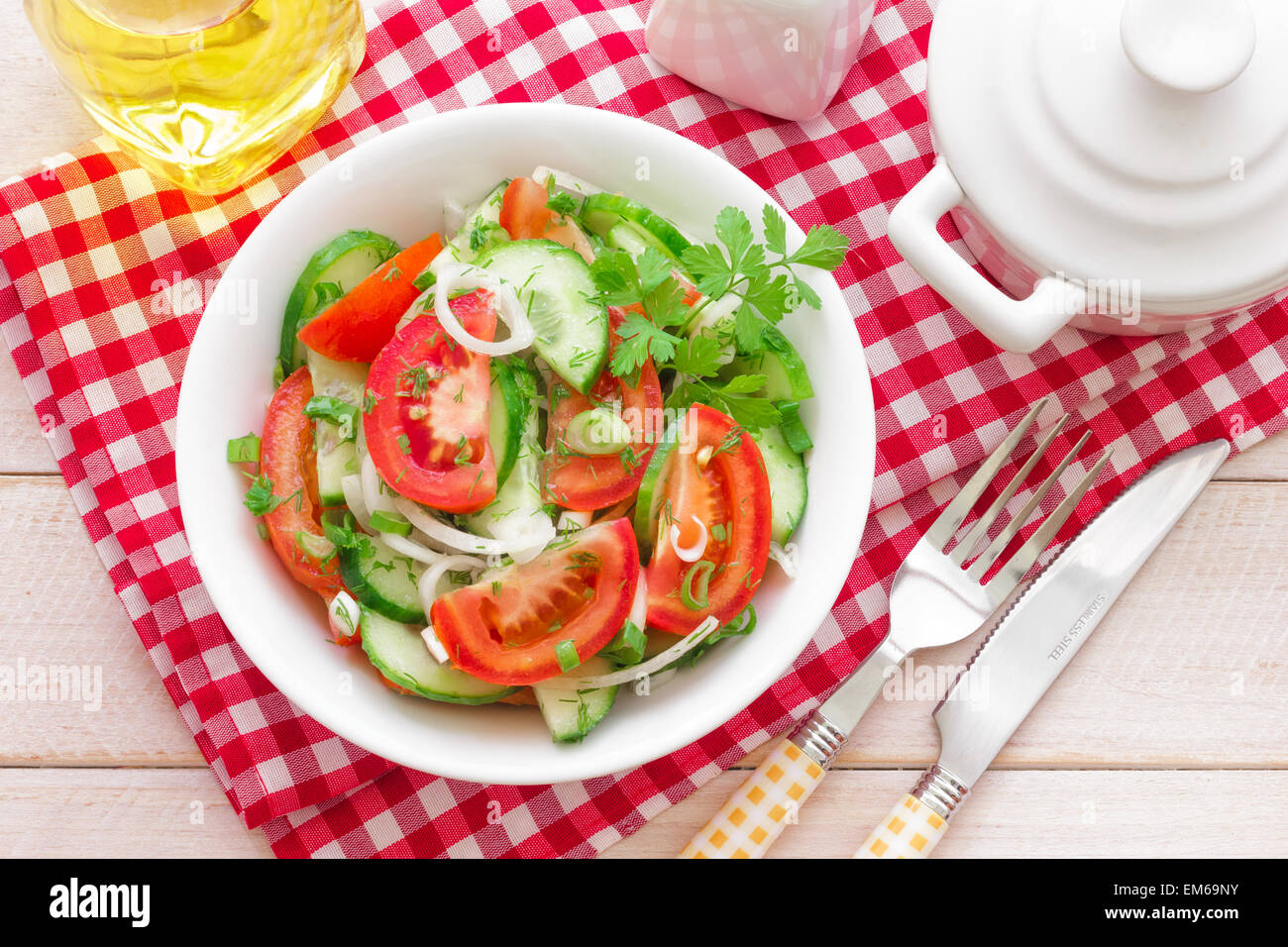 Salad with tomatoes and cucumbers Stock Photo - Alamy