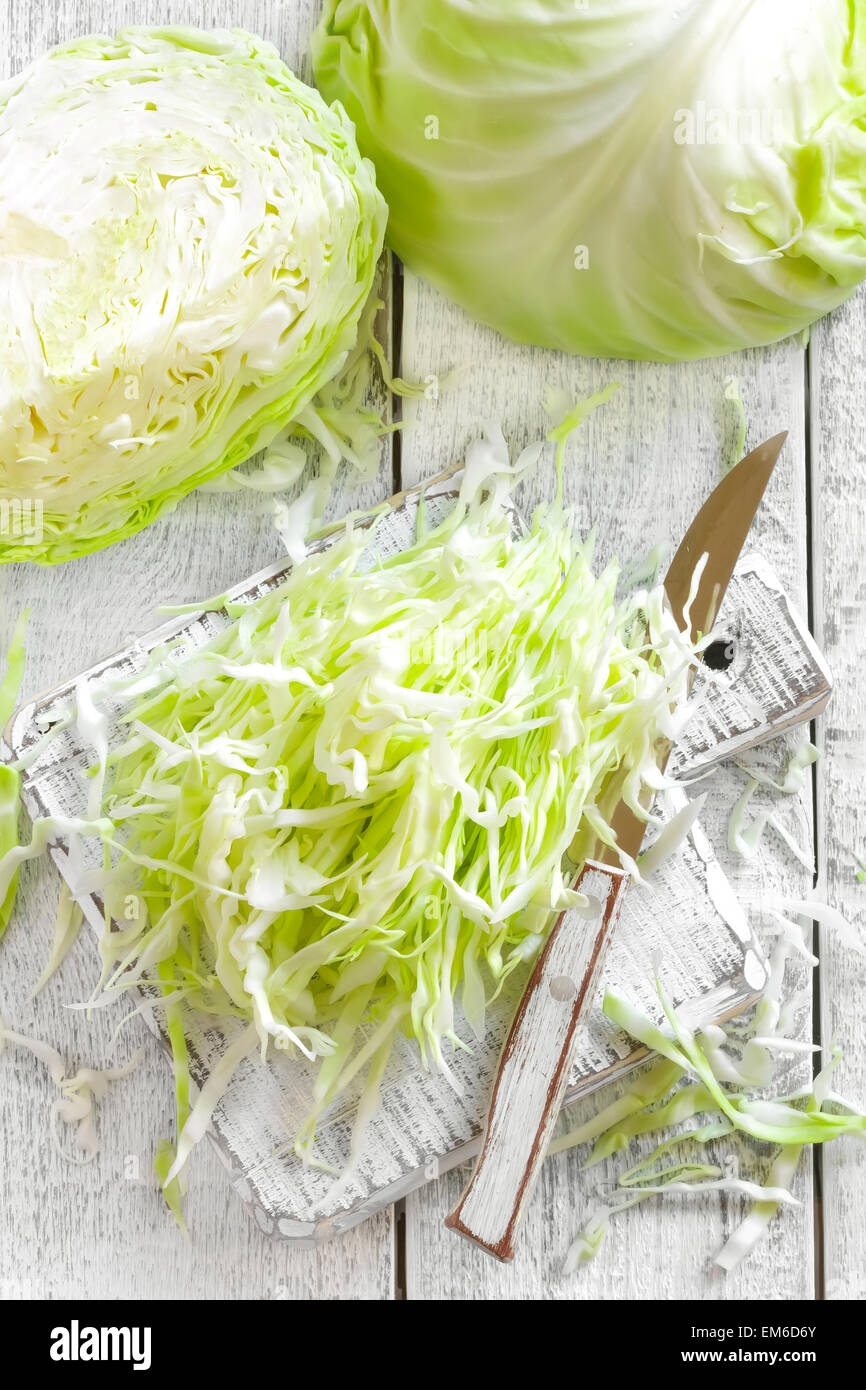 Chopped cabbage on wooden hi-res stock photography and images - Alamy
