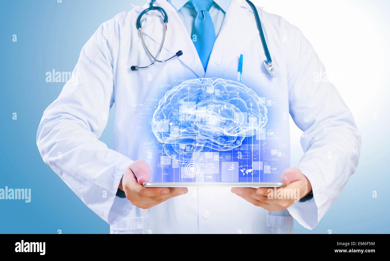 Doctor holding tablet pc Stock Photo - Alamy