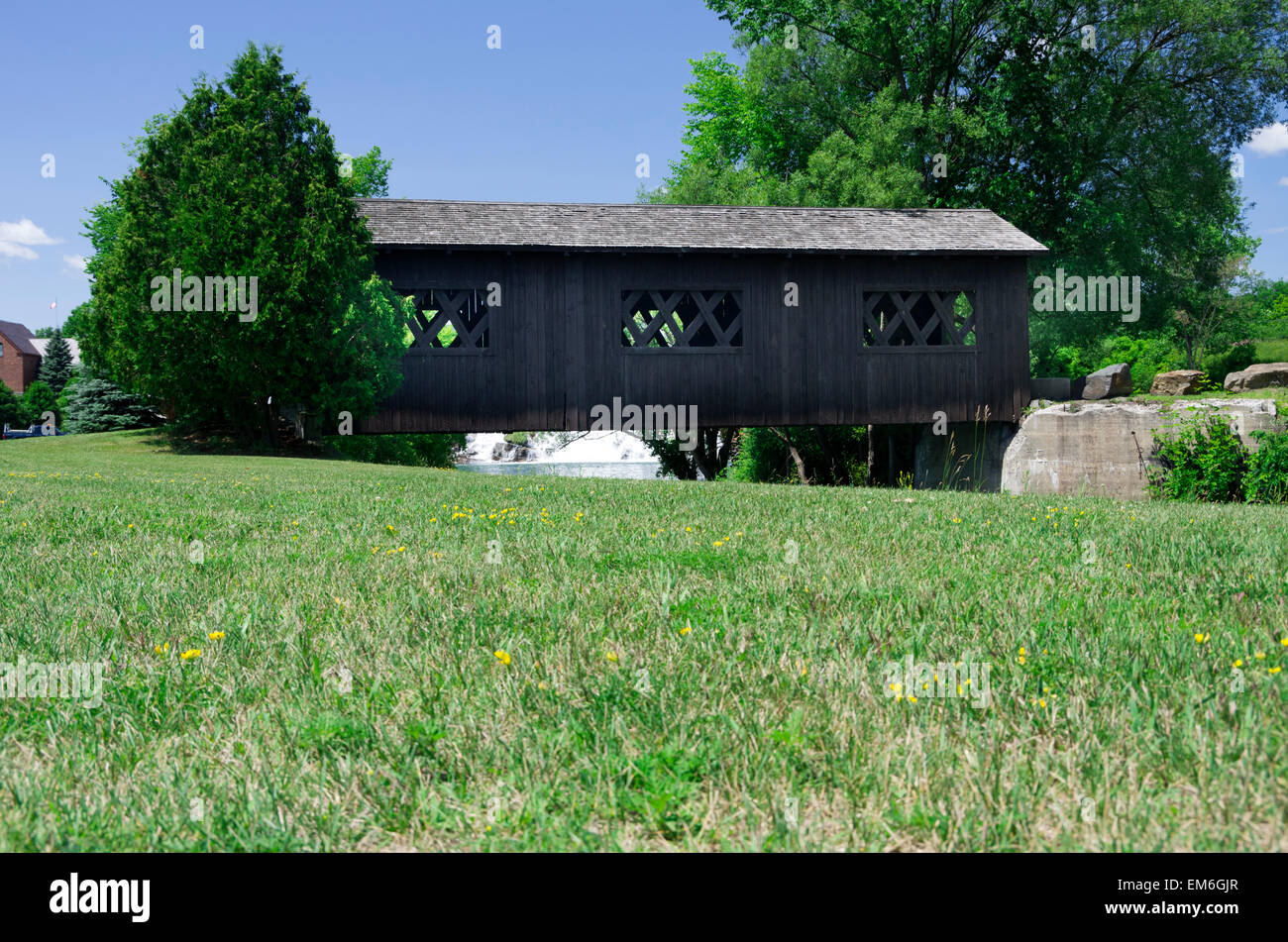 Covered bridge over La Chute River walk, connecting Lake Lake to