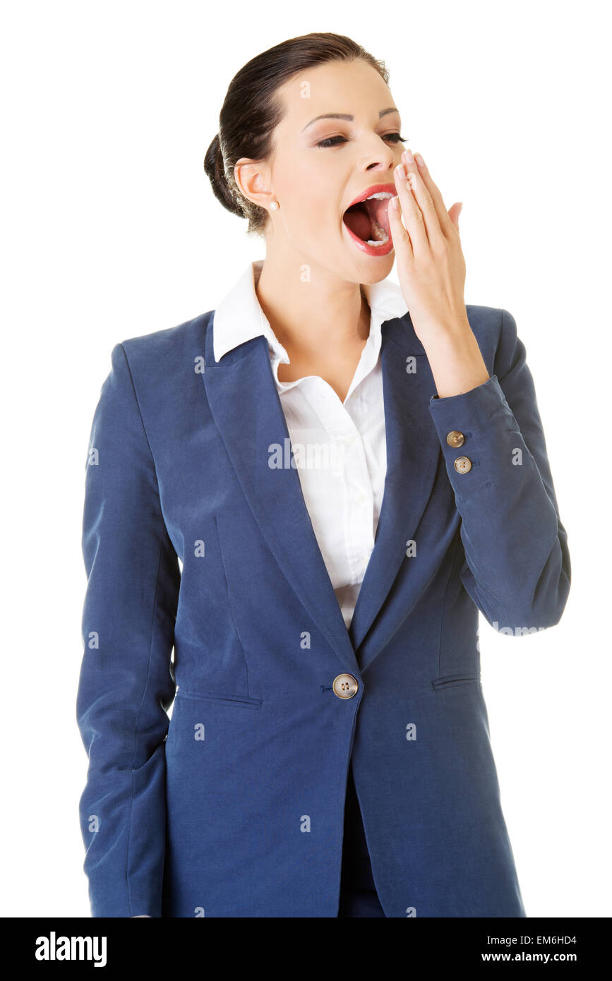 Tired business woman in a suit ,isolated over white background Stock ...