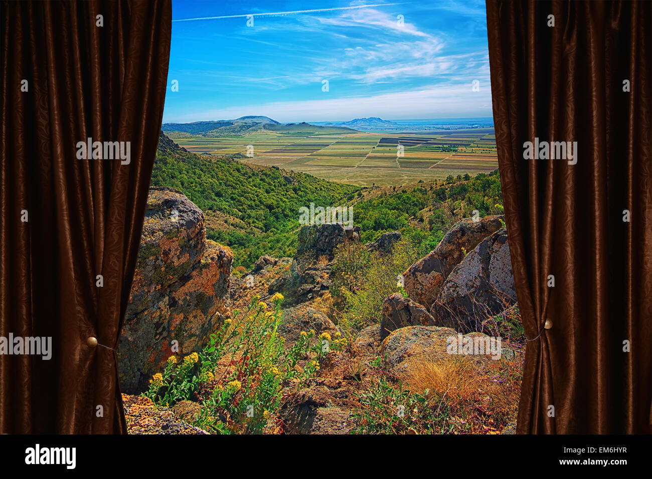Beautiful mountain view behind brown curtain Stock Photo