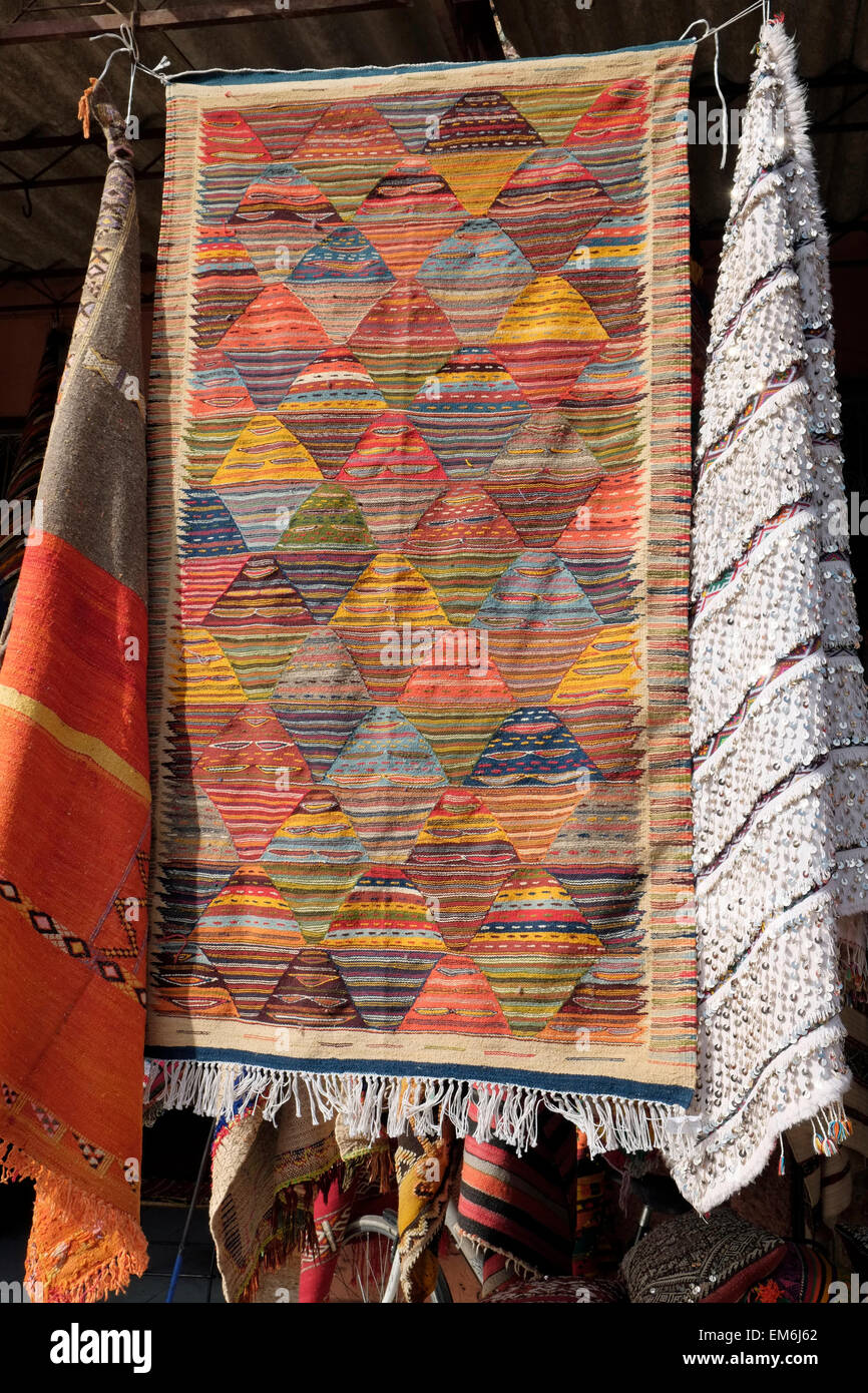 A Moroccan rug on display outside a carpet shop in the Marrakech medina