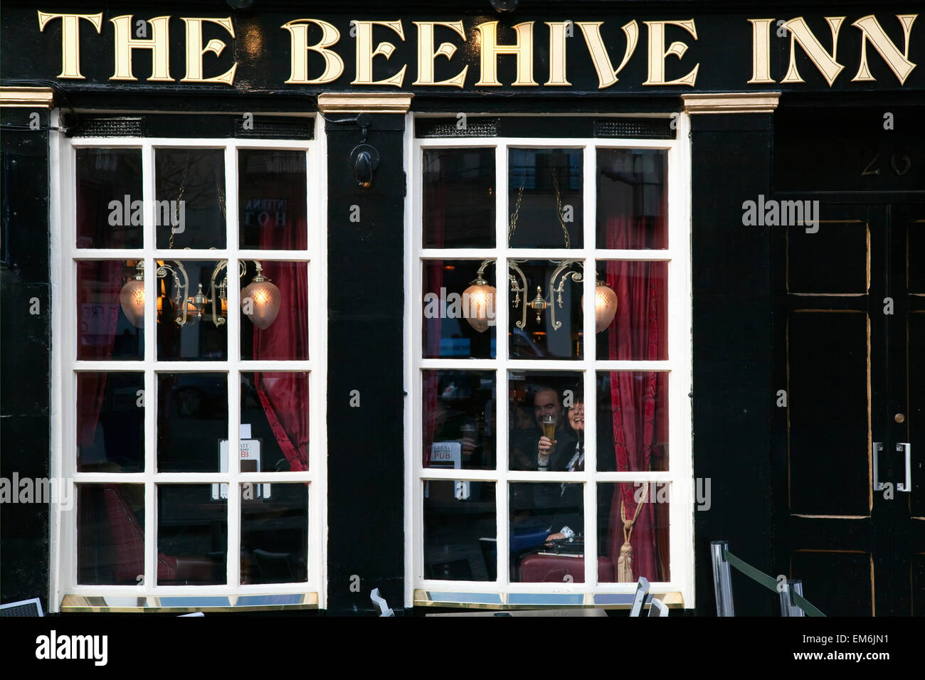 United Kingdom, Scotland, Tourists inside traditional pub; Edinburgh Stock Photo