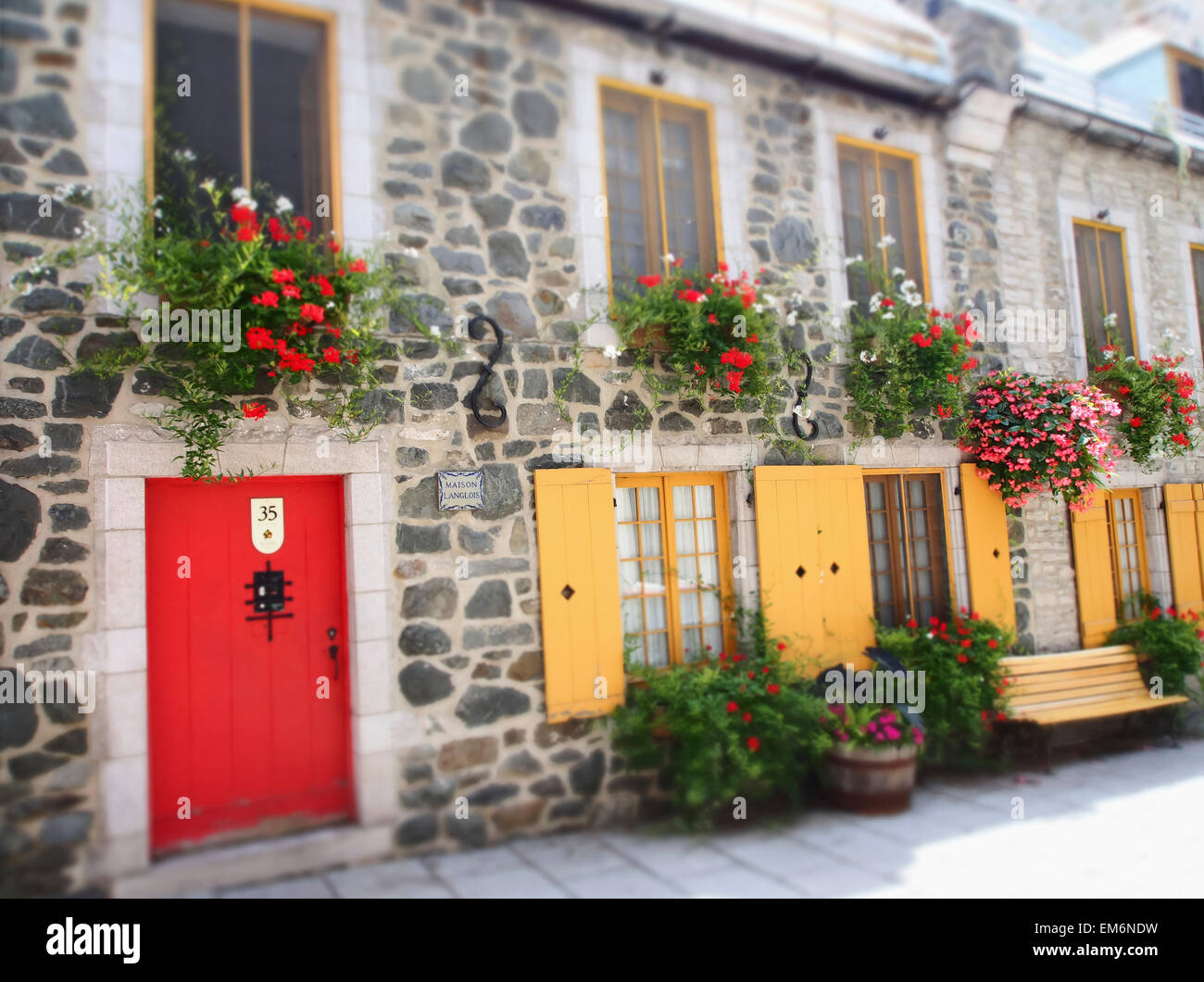 Colourful doors and window shutters on stone buildings; Quebec City