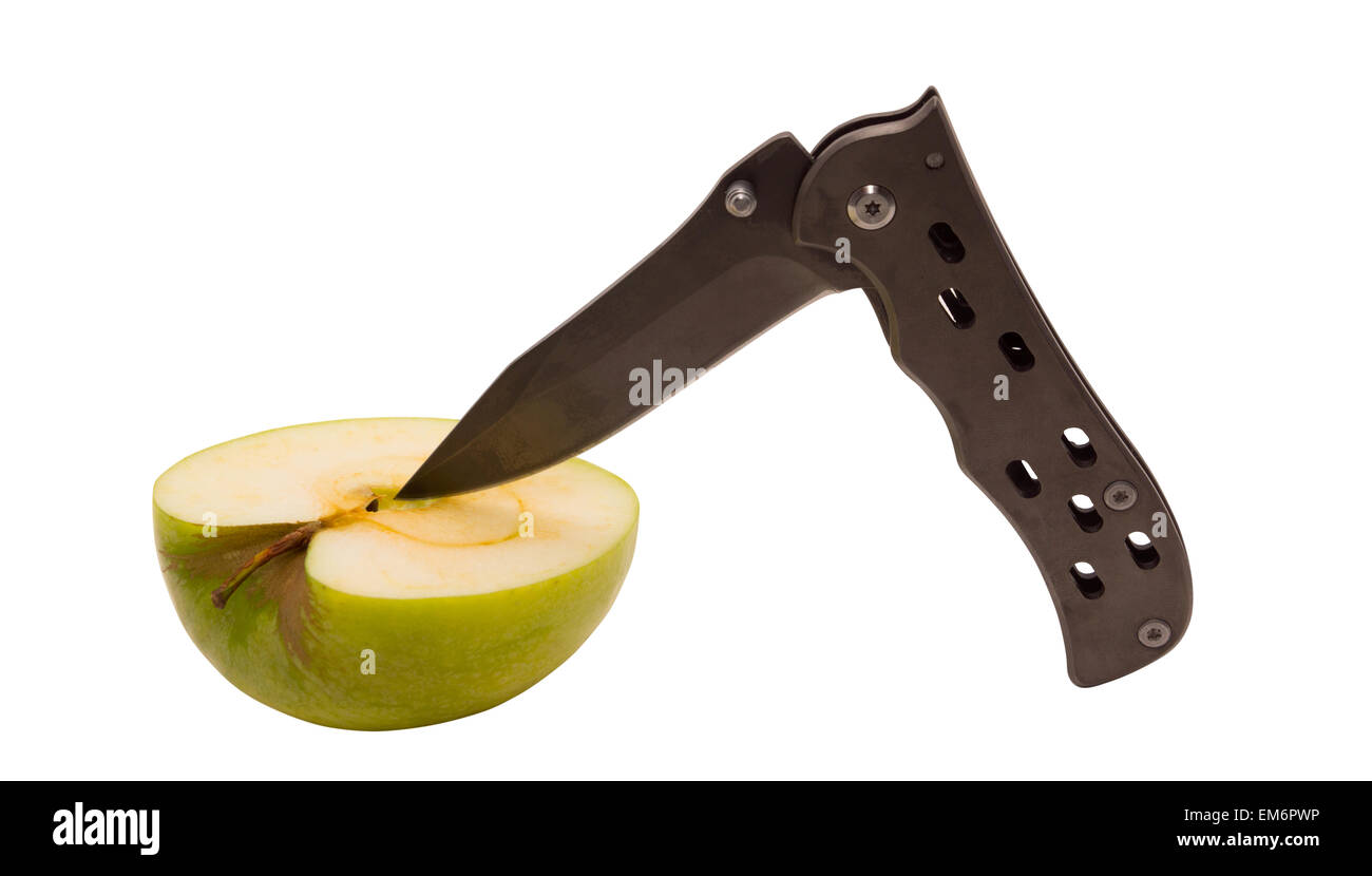 The knife and the Apple - harmonic combination. The knife cuts the Apple. Man eats the product. Stock Photo